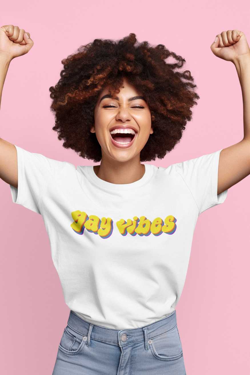 Happy person wearing LGBTQ pride t-shirts with vibrant designs, perfect for expressing pride and confidence