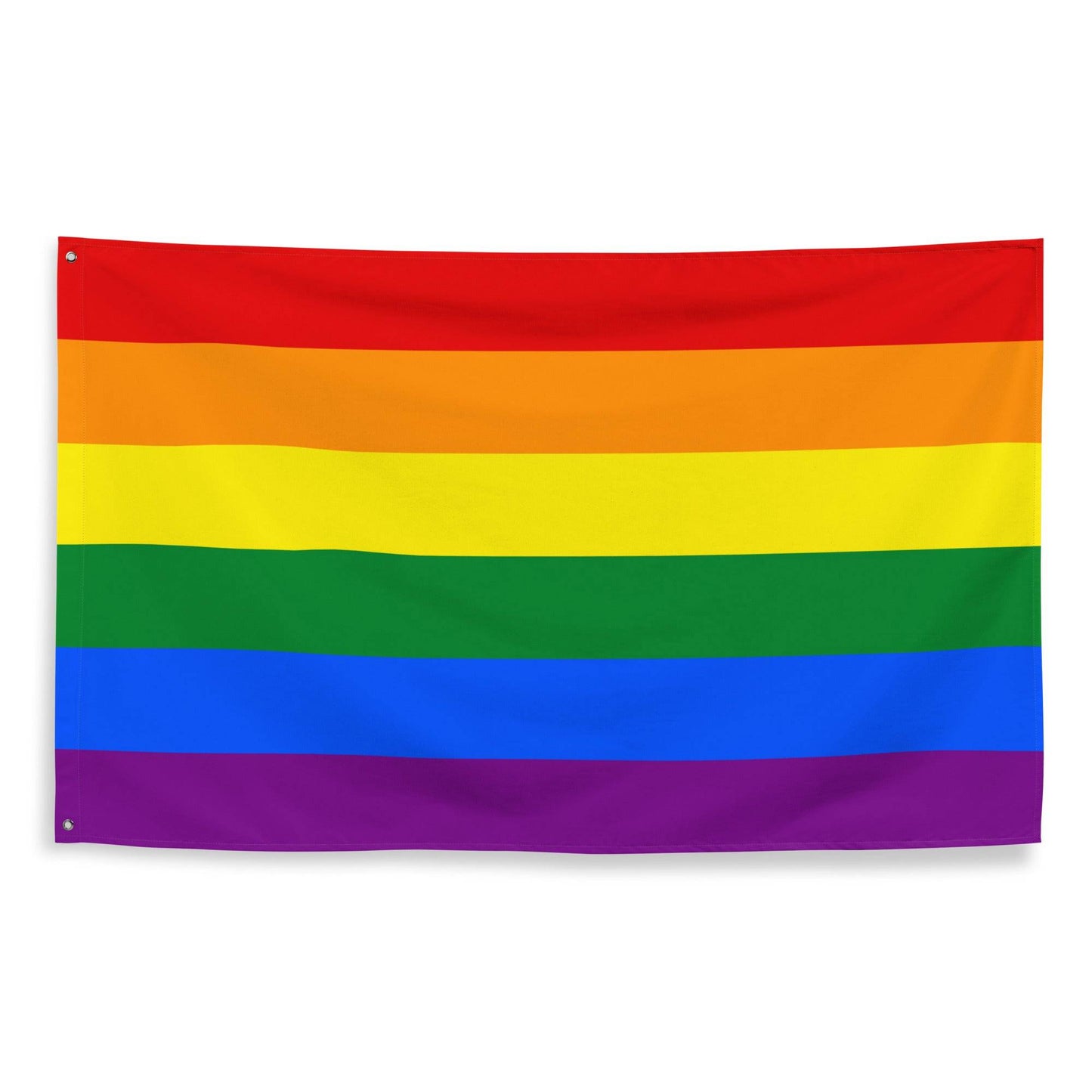 A Traditional Pride Flag from Pridelity, featuring six horizontal stripes in red, orange, yellow, green, blue, and purple, adorns the white brick wall of a charming rainbow shop.