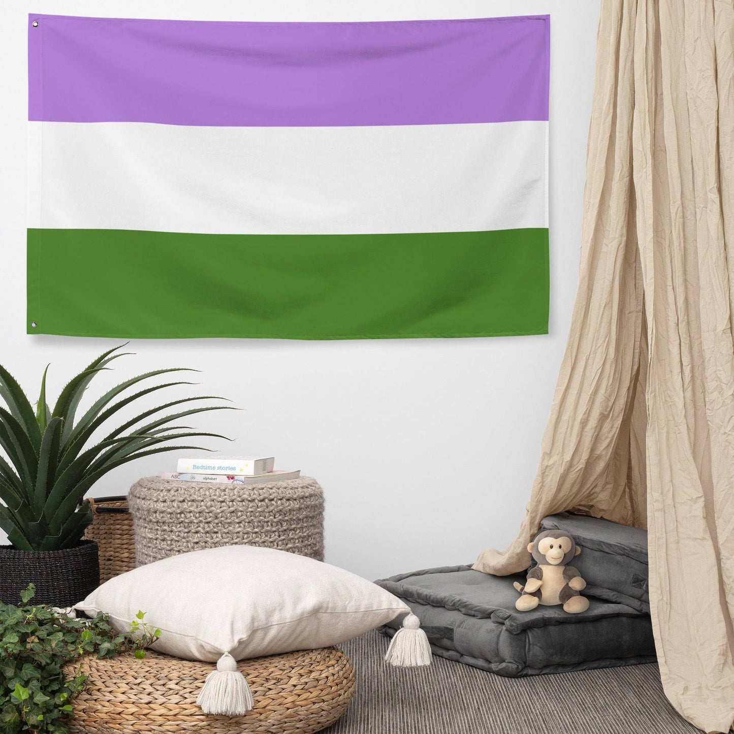 A Genderqueer Pride Flag by Pridelity, featuring three horizontal stripes of purple at the top, white in the middle, and green at the bottom, hangs proudly against a white brick wall, hinting at the vibrant offerings of a rainbow shop.