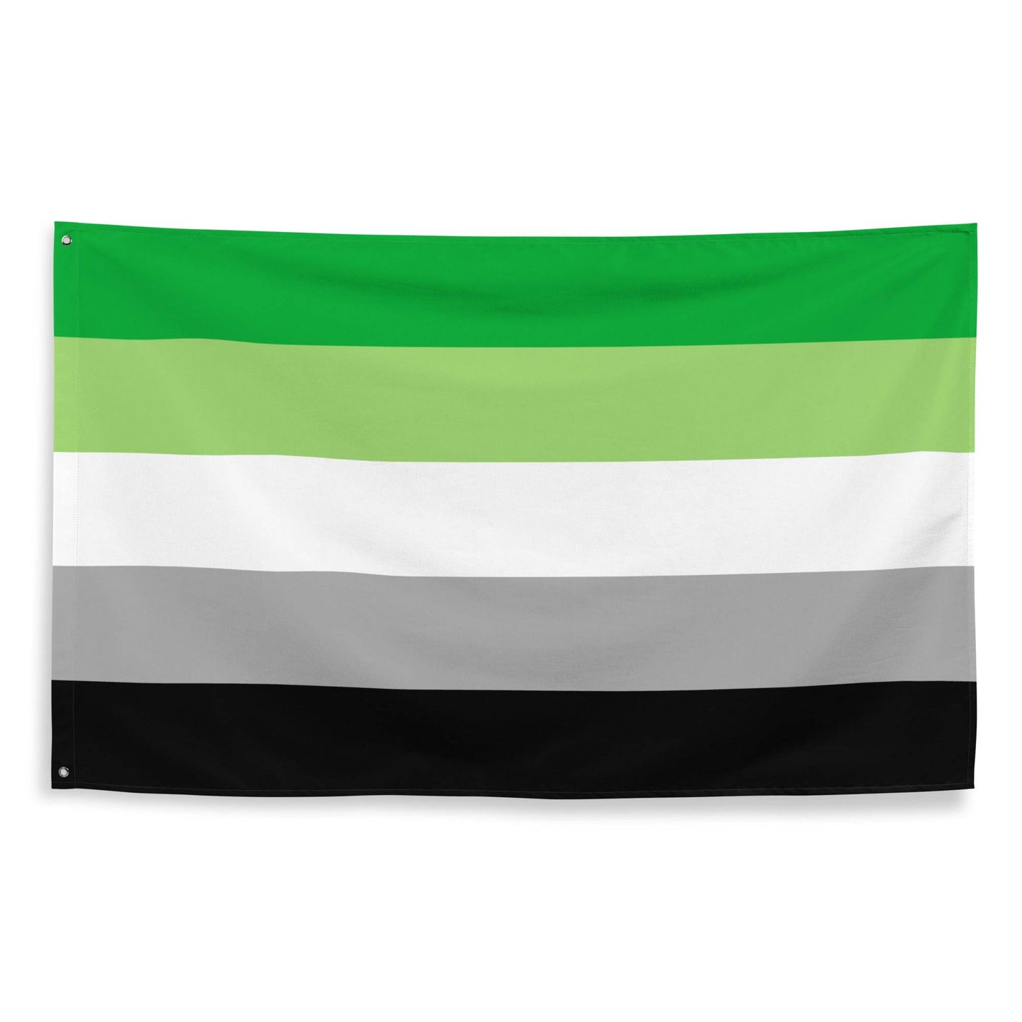 Image of Pridelity’s Aromantic Pride Flag hanging on a white brick wall, showcasing the vibrant colors of dark green, light green, white, gray, and black. This striking piece is part of our exclusive Pride Collections.