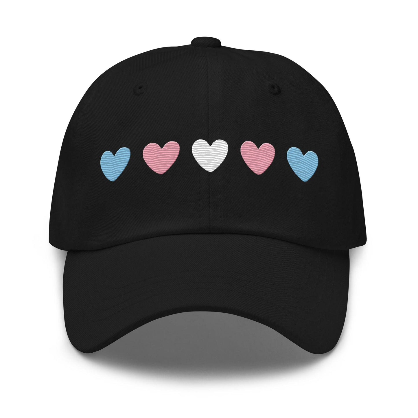 Introducing the "Trans Hearts Cap" from Pridelity, a black baseball cap adorned with embroidered pastel heart designs in pink, white, and blue on the front, making it an ideal accessory to enhance your pride outfits.