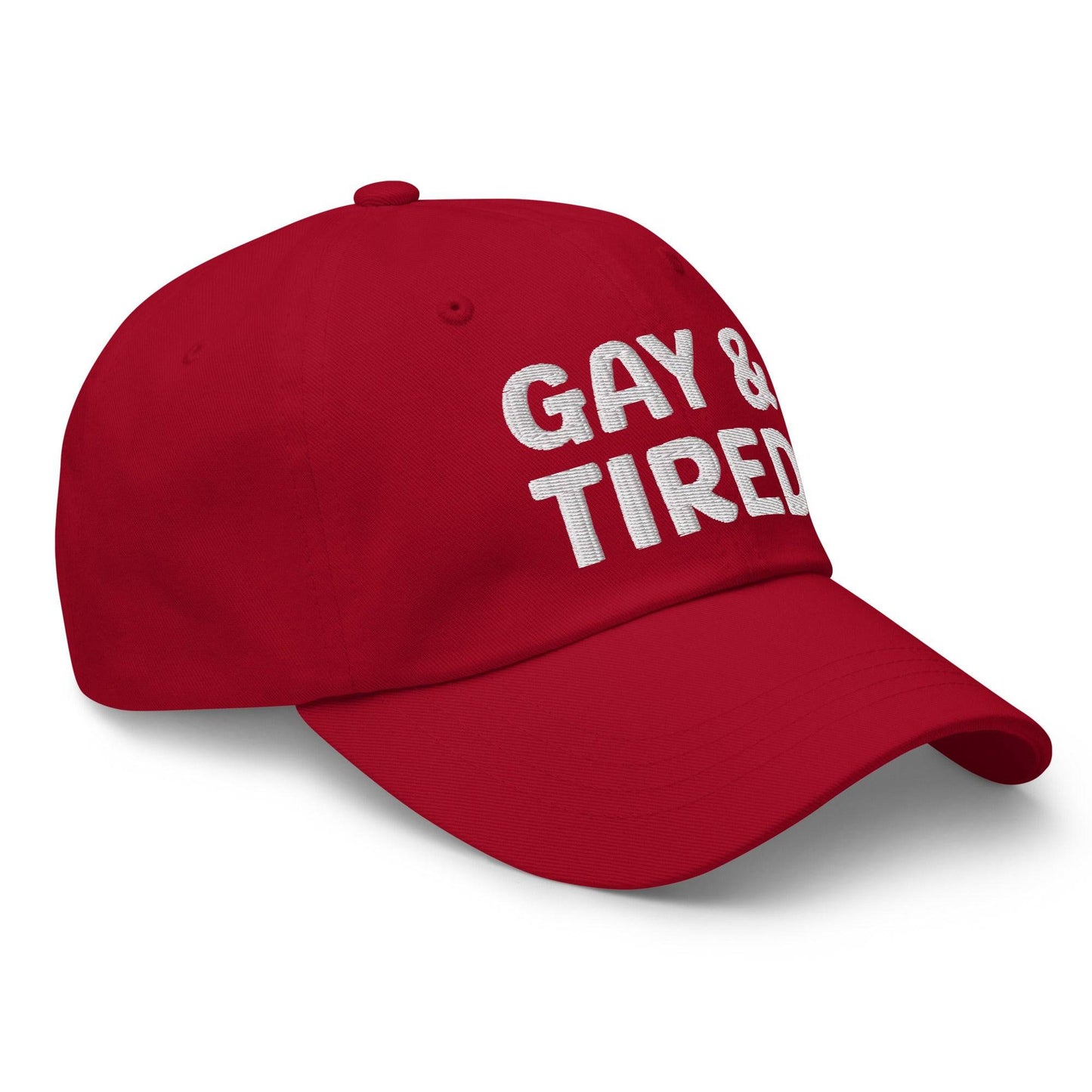 Introducing the Gay & Tired Cap by Pridelity, featuring bold white "GAY & TIRED" embroidery on its sleek black design—an ideal addition to bring both honesty and style to your pride outfits.