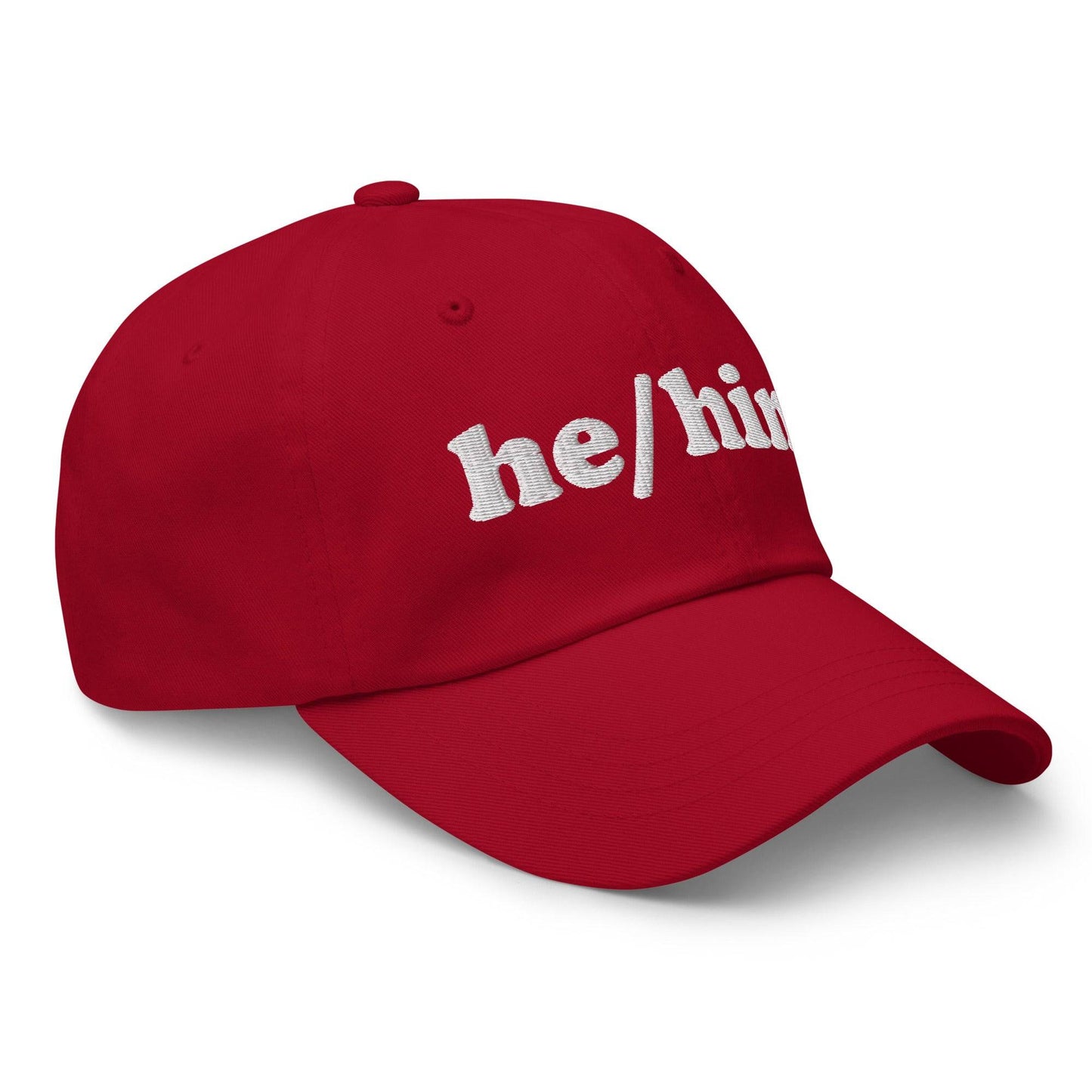 Introducing the He/Him Cap by Pridelity: A stylish black cap featuring "he/him" embroidered in white on the front. It adds a subtle yet meaningful touch to pride outfits while celebrating identity with simplicity and elegance.