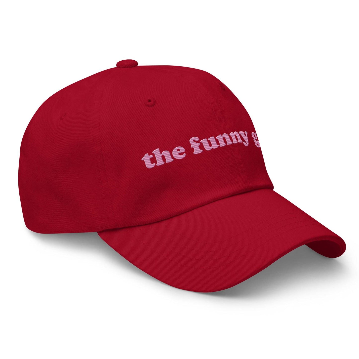 Introducing "The Funny Gay Cap" by Pridelity, a white cap featuring pink embroidered text that reads "the funny gay," ideal for adding a playful flair to your pride ensembles.