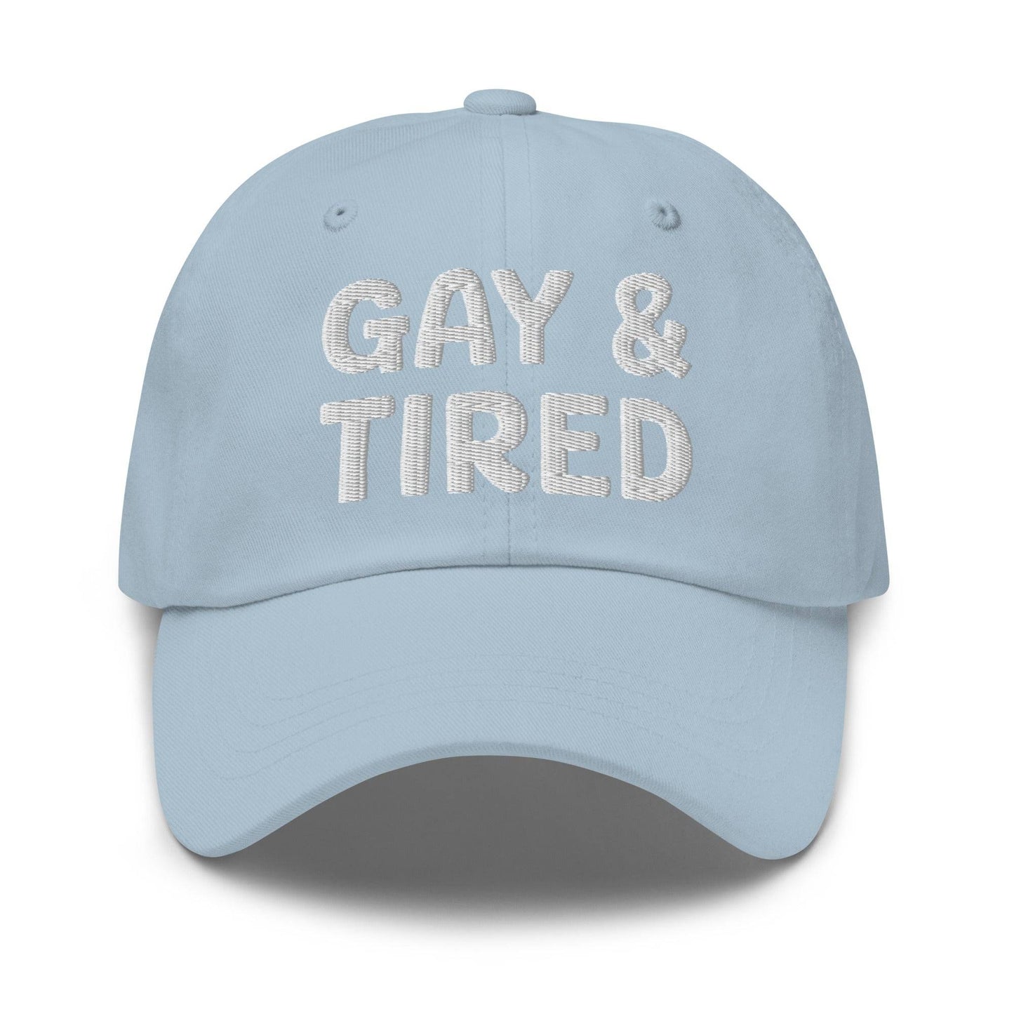 Introducing the Gay & Tired Cap by Pridelity, featuring bold white "GAY & TIRED" embroidery on its sleek black design—an ideal addition to bring both honesty and style to your pride outfits.