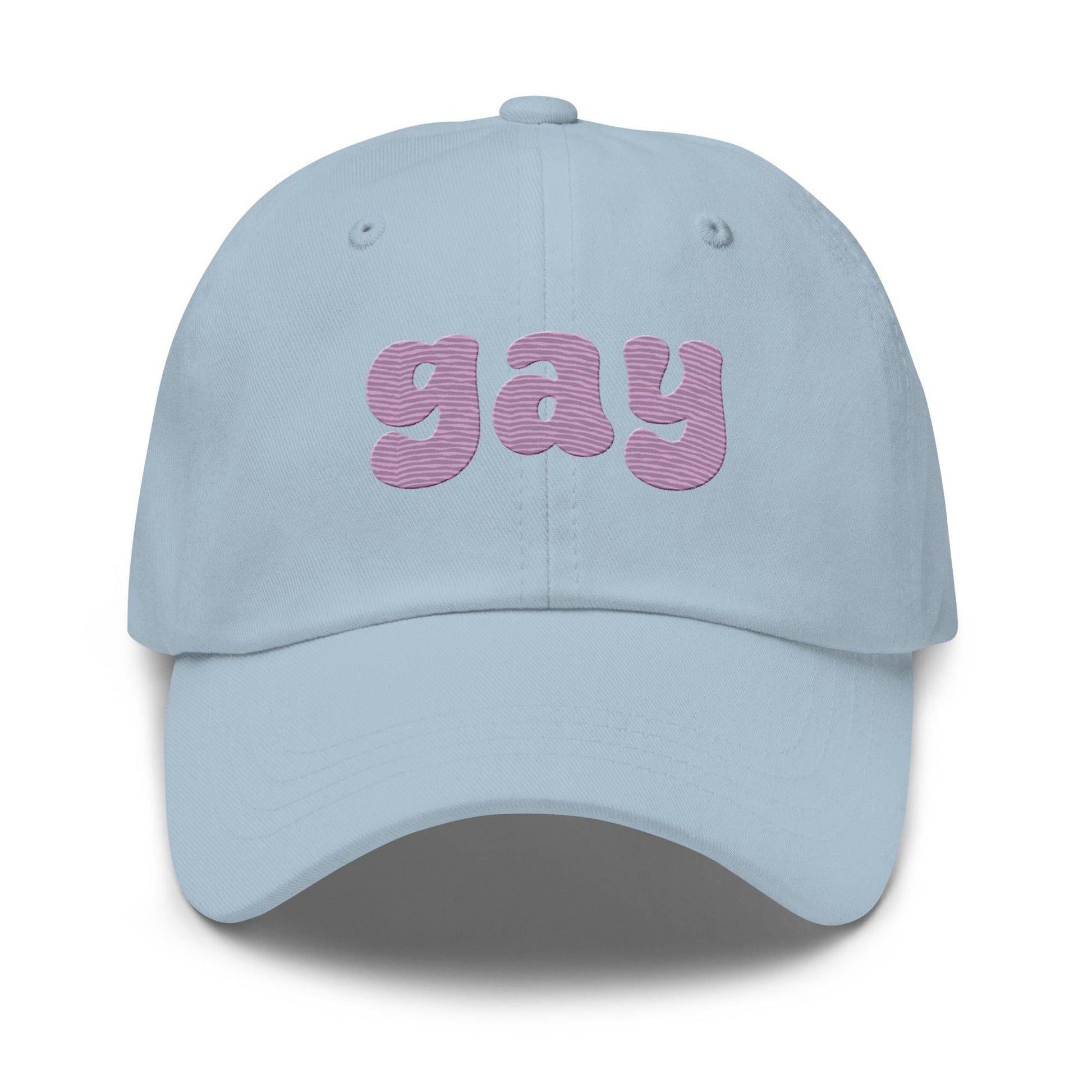 Black Pridelity "Gay Cap" featuring bold, purple, bubble-like letters on the front, perfect for complementing your pride outfits.