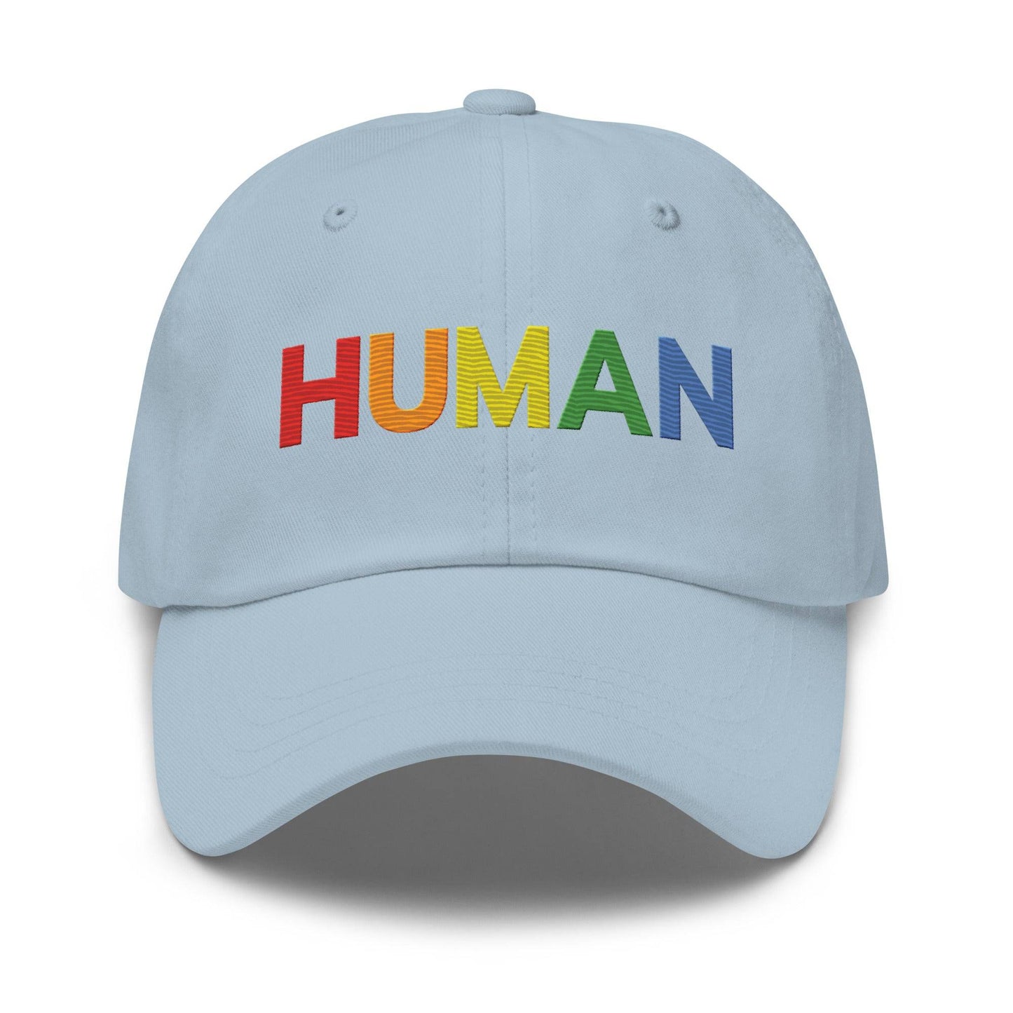 The Pridelity Human Cap is a black baseball hat, ideal for complementing pride ensembles, with the word "HUMAN" embroidered in vibrant rainbow colors on the front.