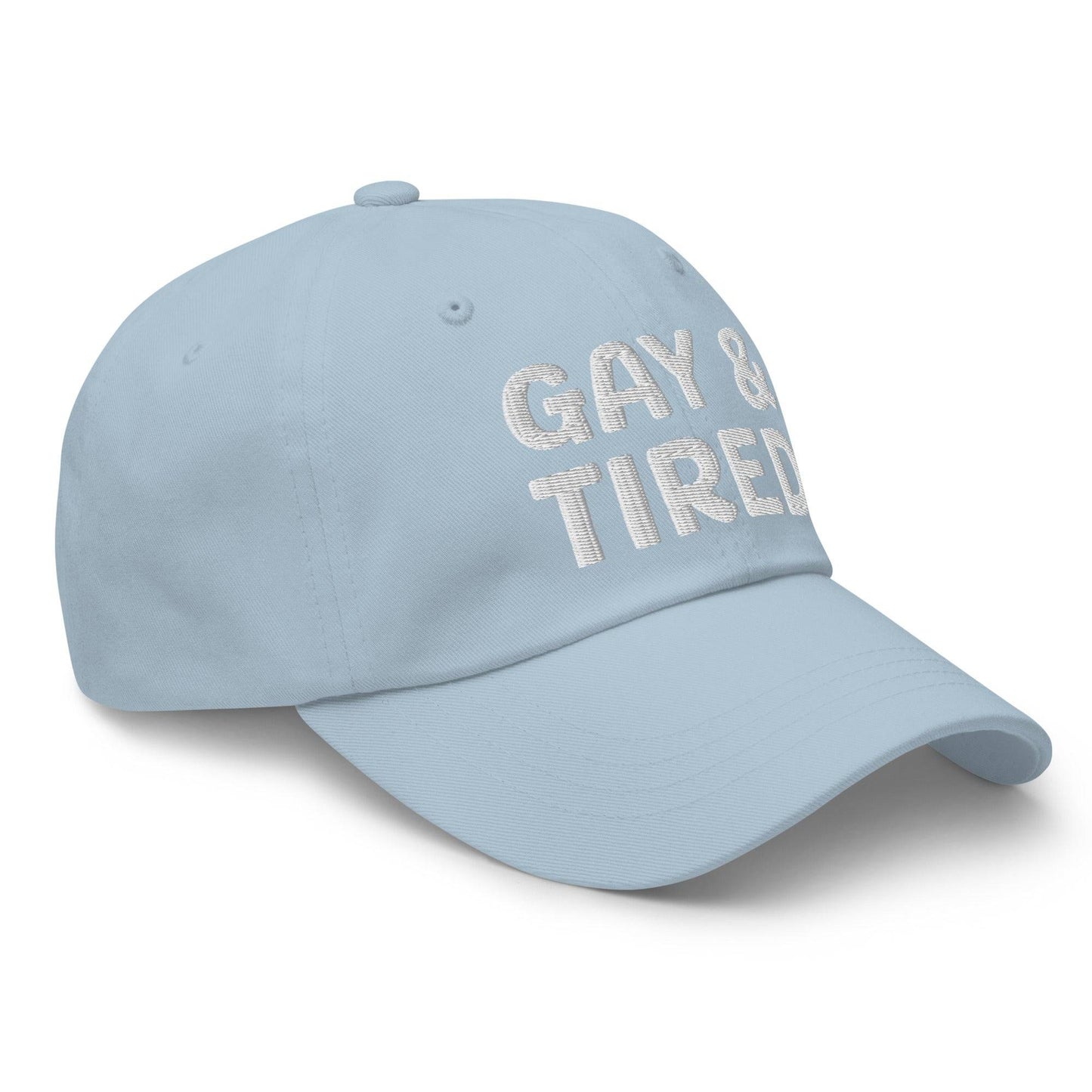 Introducing the Gay & Tired Cap by Pridelity, featuring bold white "GAY & TIRED" embroidery on its sleek black design—an ideal addition to bring both honesty and style to your pride outfits.
