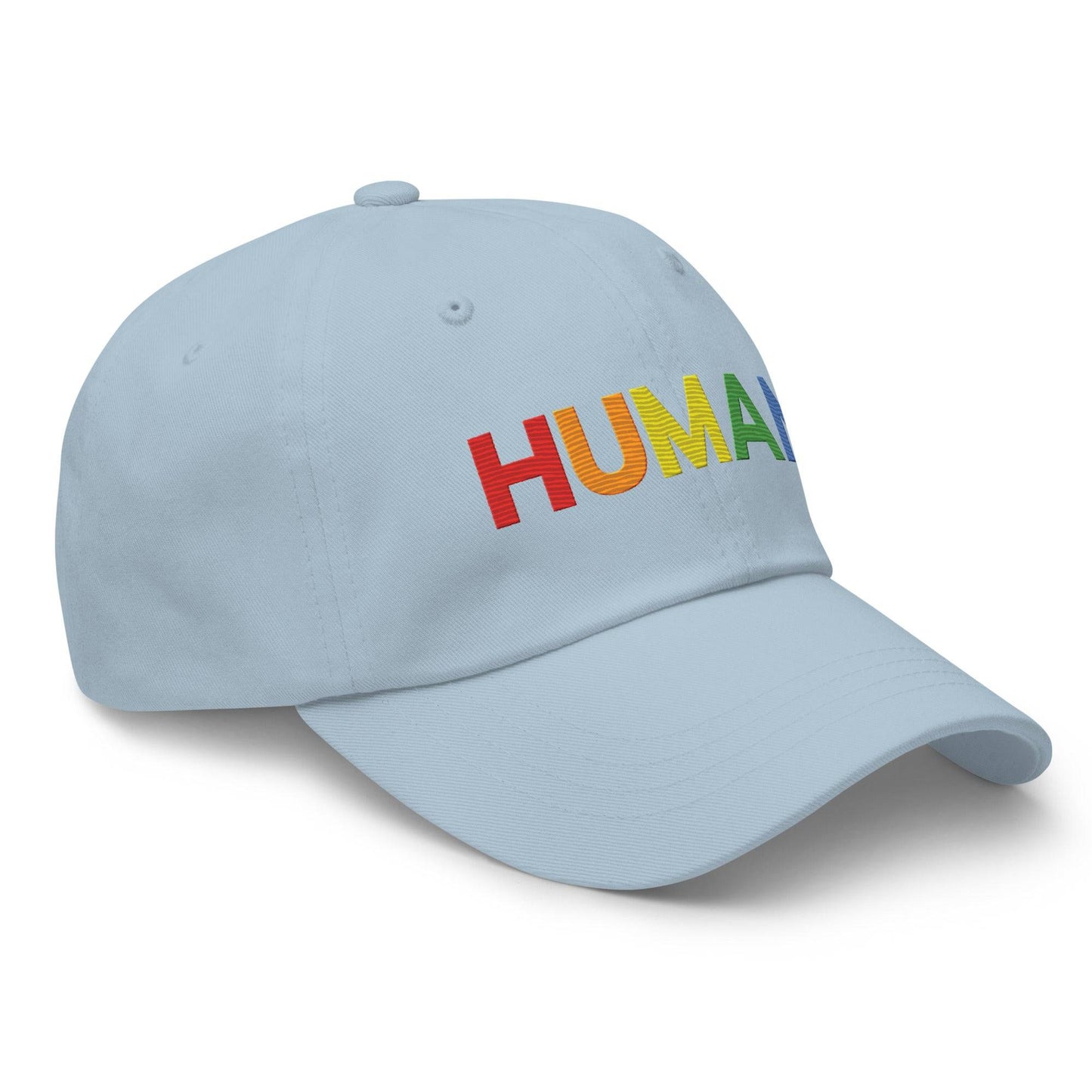 The Pridelity Human Cap is a black baseball hat, ideal for complementing pride ensembles, with the word "HUMAN" embroidered in vibrant rainbow colors on the front.