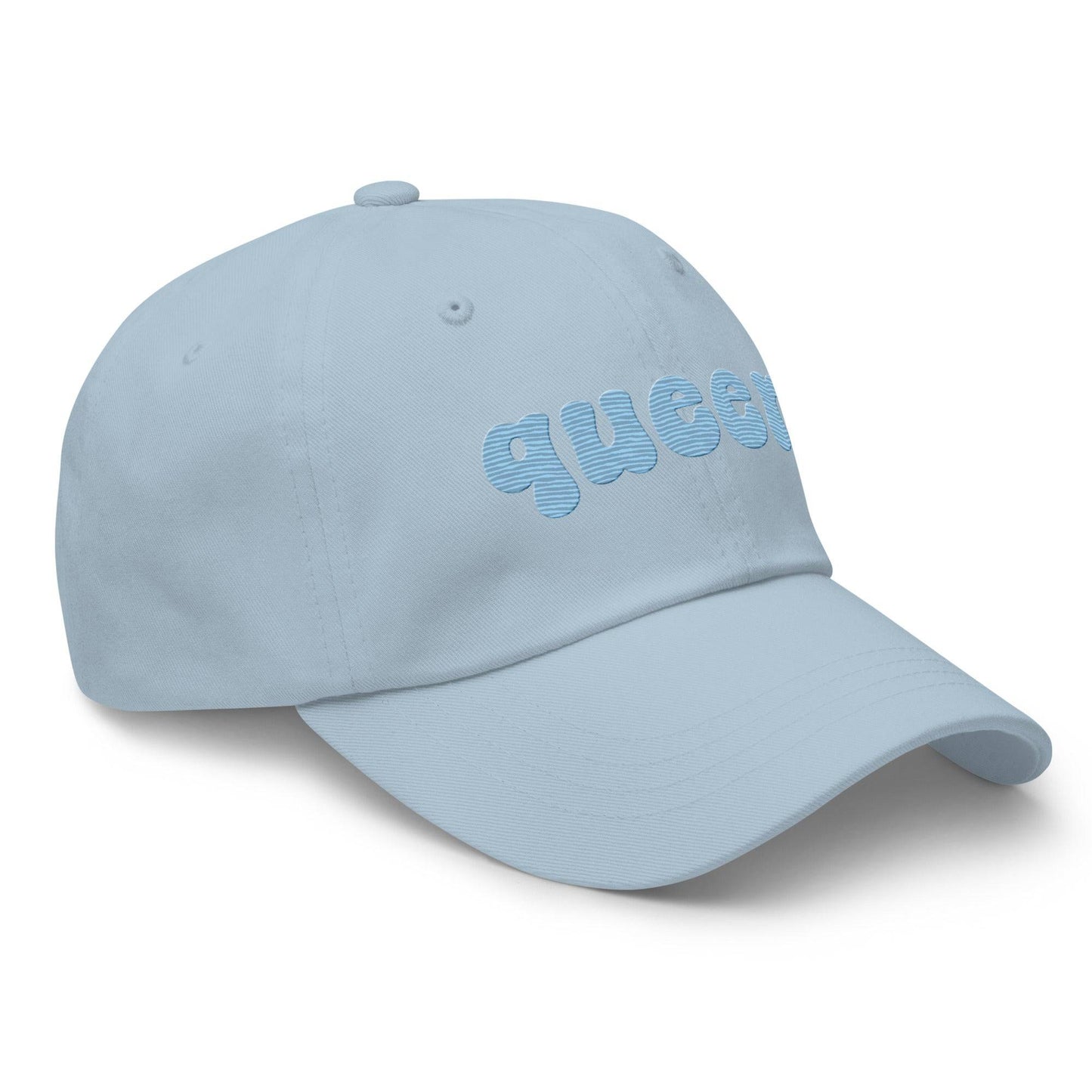 Introducing the Queer Cap by Pridelity, a black baseball cap with "queer" elegantly embroidered in light blue bold, rounded letters on the front. Perfect for pride outfits, it features a curved brim and top ventilation eyelets for added comfort.