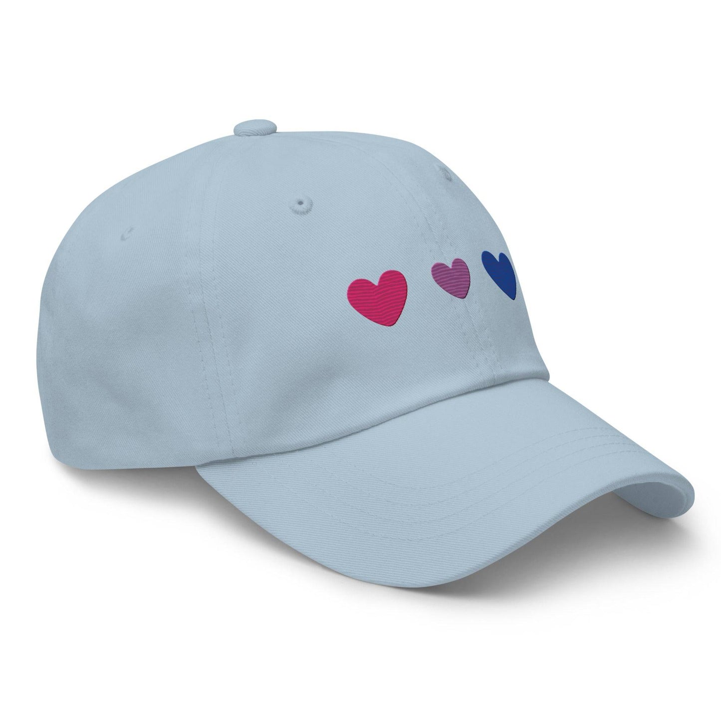Introducing the Bisexual Hearts Cap by Pridelity, a black baseball cap from our Pride Collections featuring three embroidered hearts in a row on the front, colored pink, purple, and blue from left to right.
