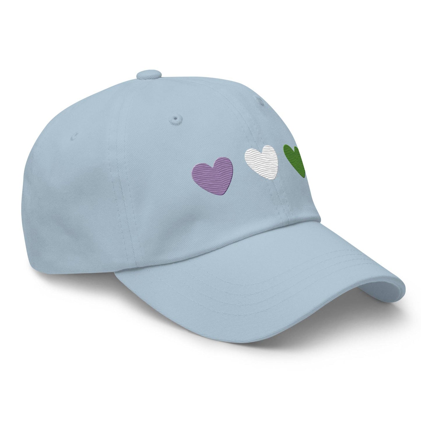 The Genderqueer Hearts Cap by Pridelity is a black baseball cap, ideal for pride outfits, featuring three heart designs embroidered on the front in purple, white, and green from left to right.