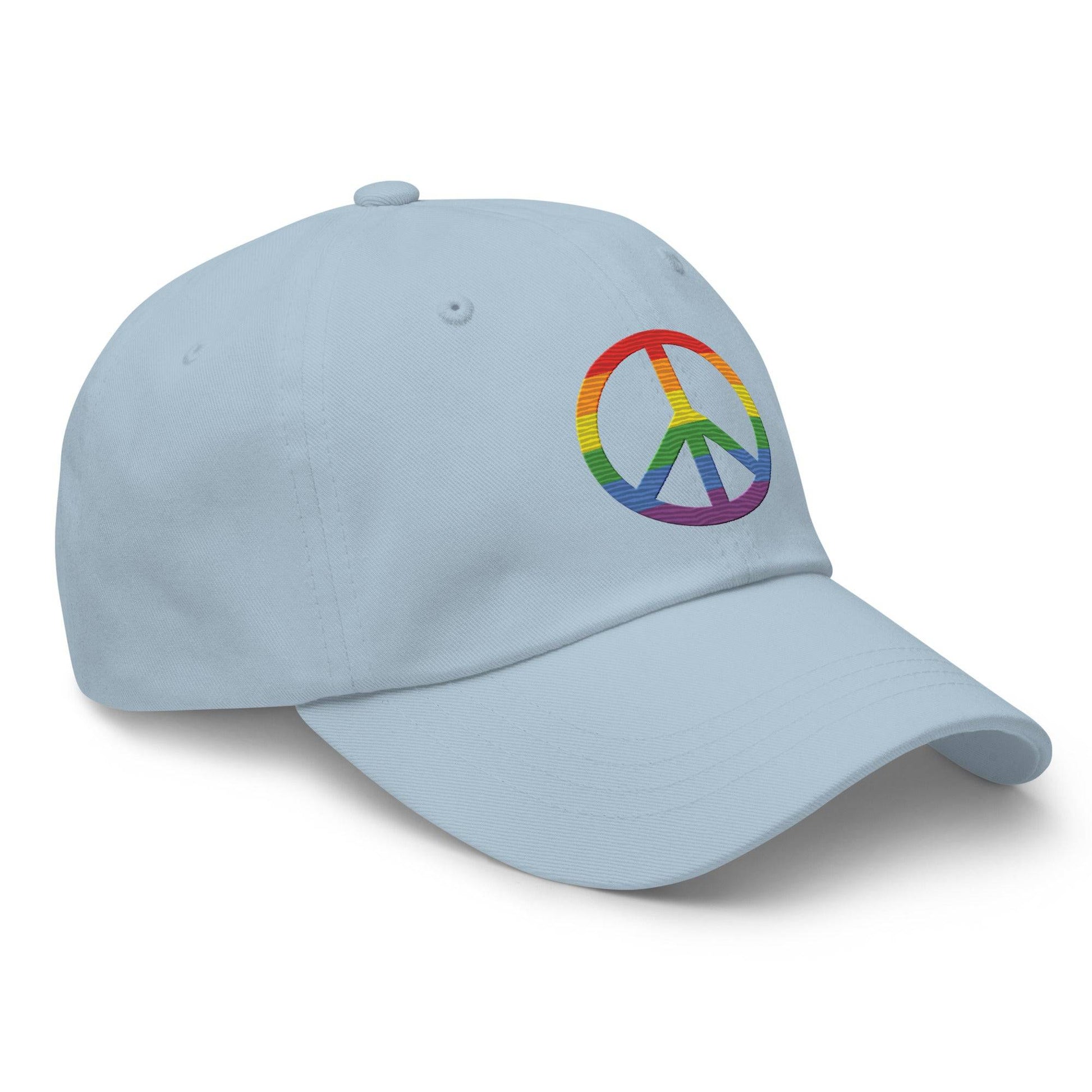 The "Peace Cap" by Pridelity is a black baseball cap ideal for pride outfits, featuring a rainbow-colored peace sign on the front.