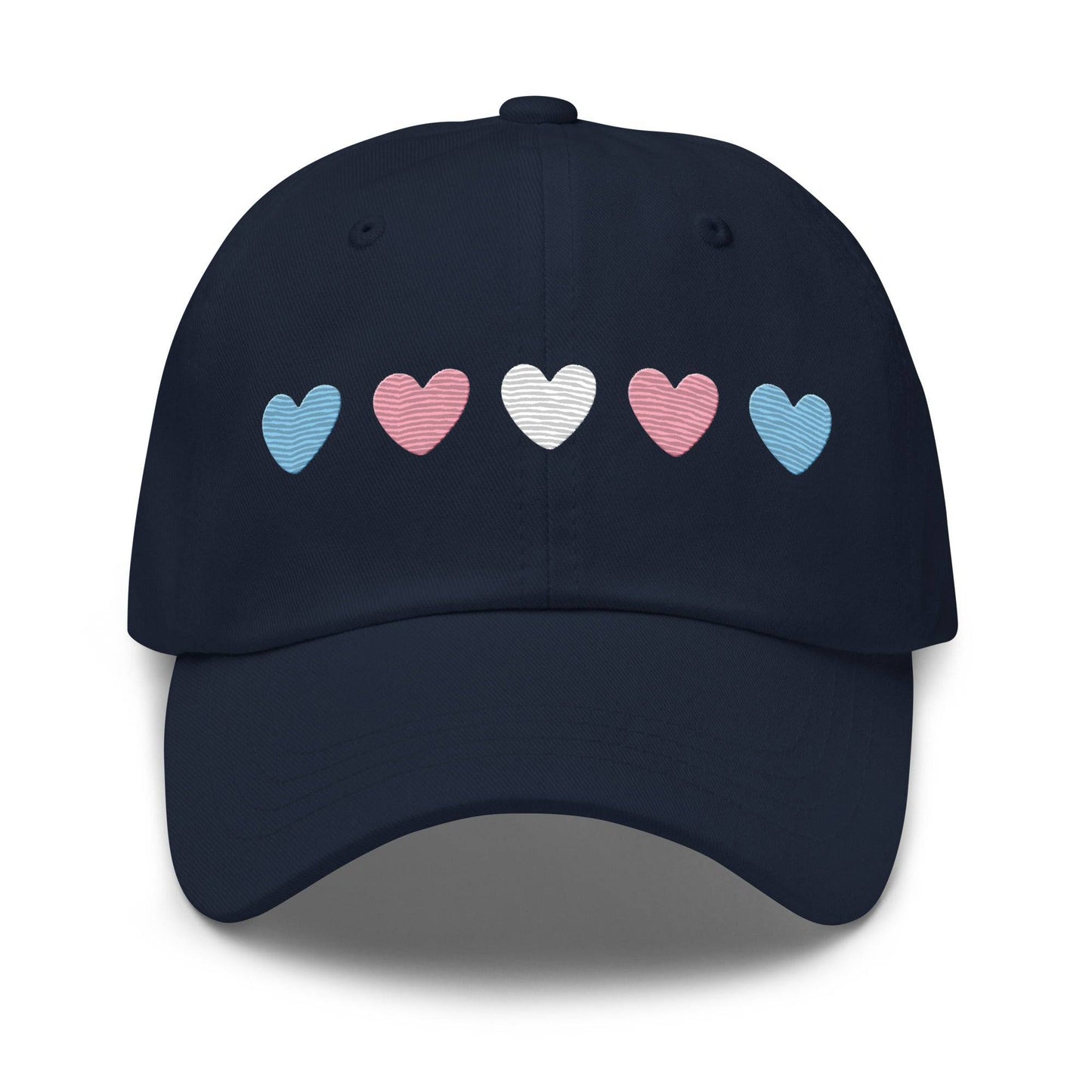 Introducing the "Trans Hearts Cap" from Pridelity, a black baseball cap adorned with embroidered pastel heart designs in pink, white, and blue on the front, making it an ideal accessory to enhance your pride outfits.