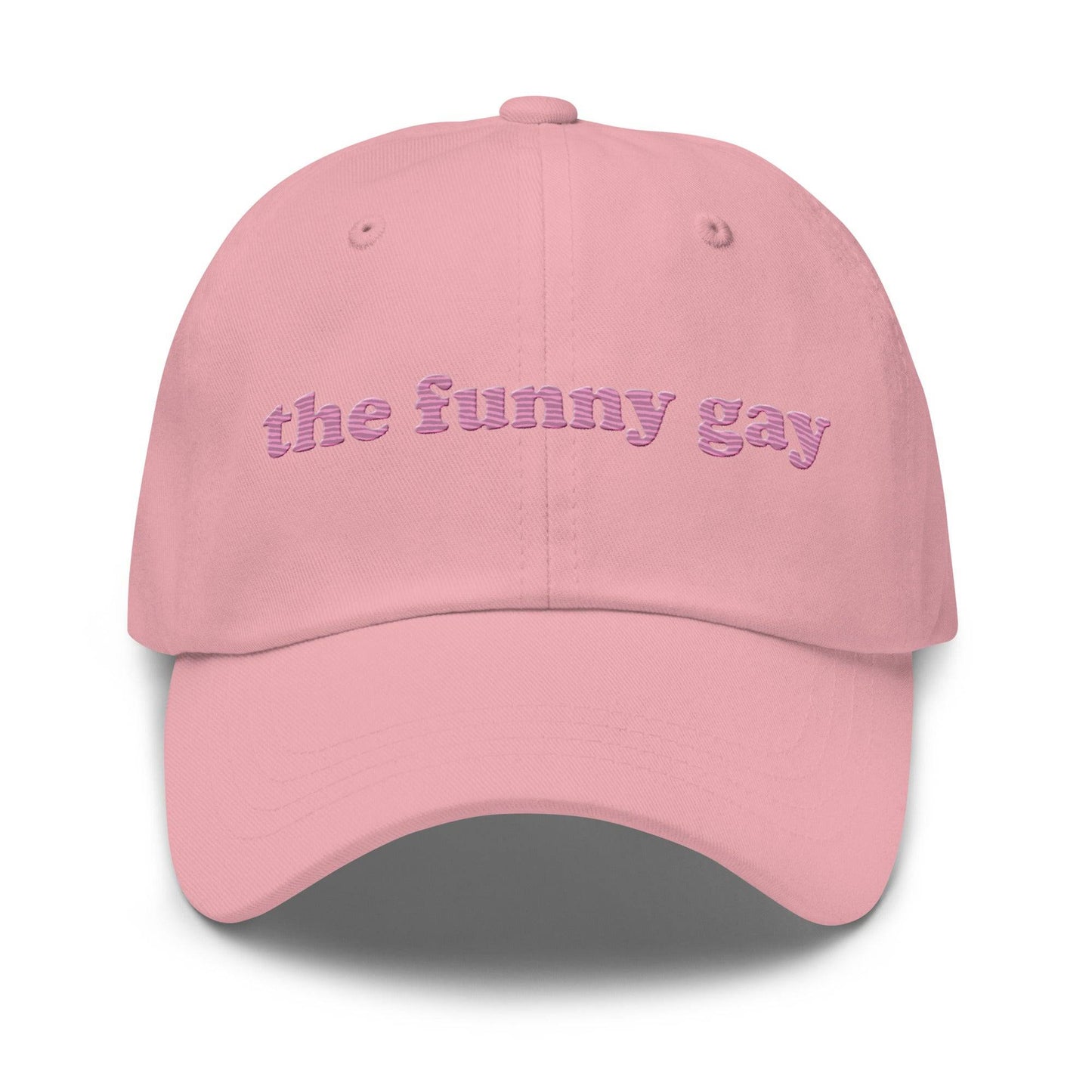 Introducing "The Funny Gay Cap" by Pridelity, a white cap featuring pink embroidered text that reads "the funny gay," ideal for adding a playful flair to your pride ensembles.