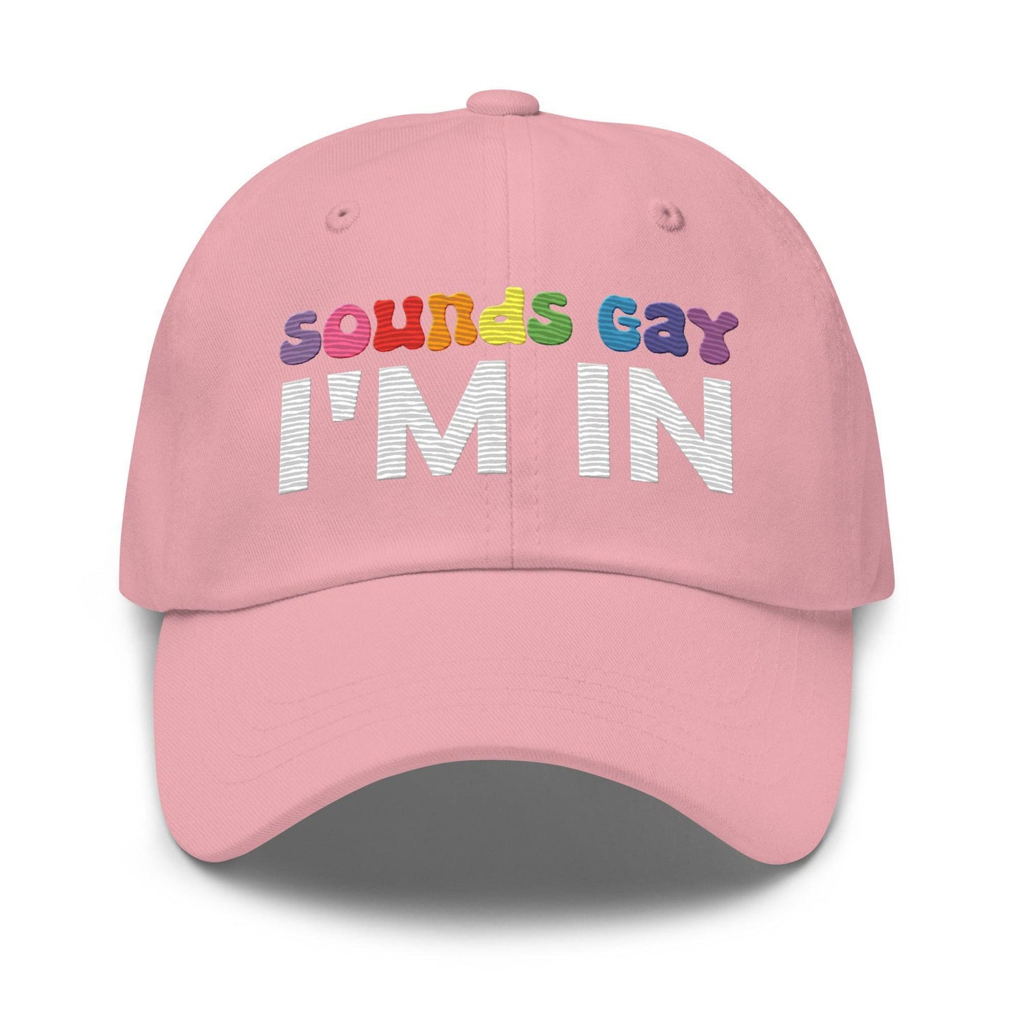 Introducing the "Sounds Gay I'm In Cap" by Pridelity, a black baseball cap ideal for pride outfits. It showcases the vibrant phrase "Sounds Gay" in contrast to the striking white "I'm In," making it a standout accessory for any celebration.