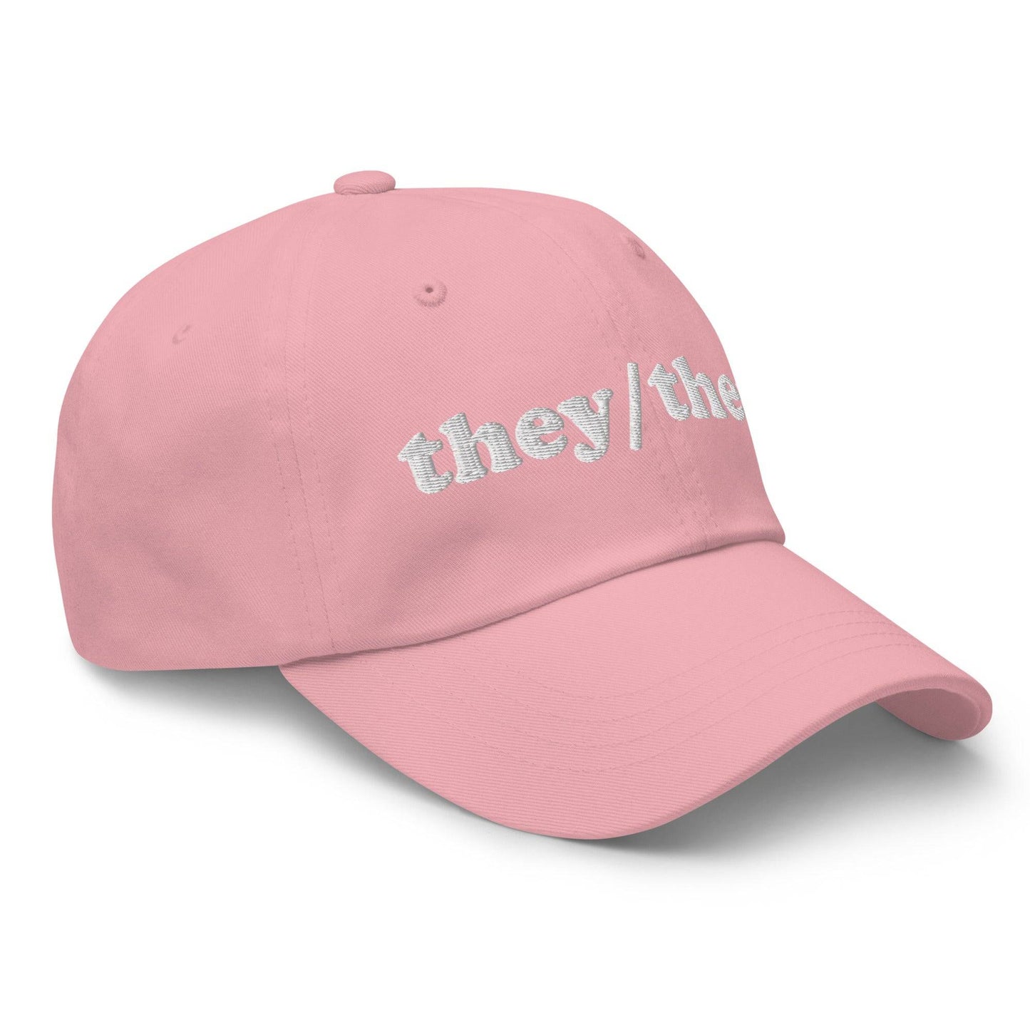 Introducing the They/Them Cap by Pridelity, a stylish black cap with "they/them" embroidered in white on the front, making it an ideal accessory for pairing with pride outfits.