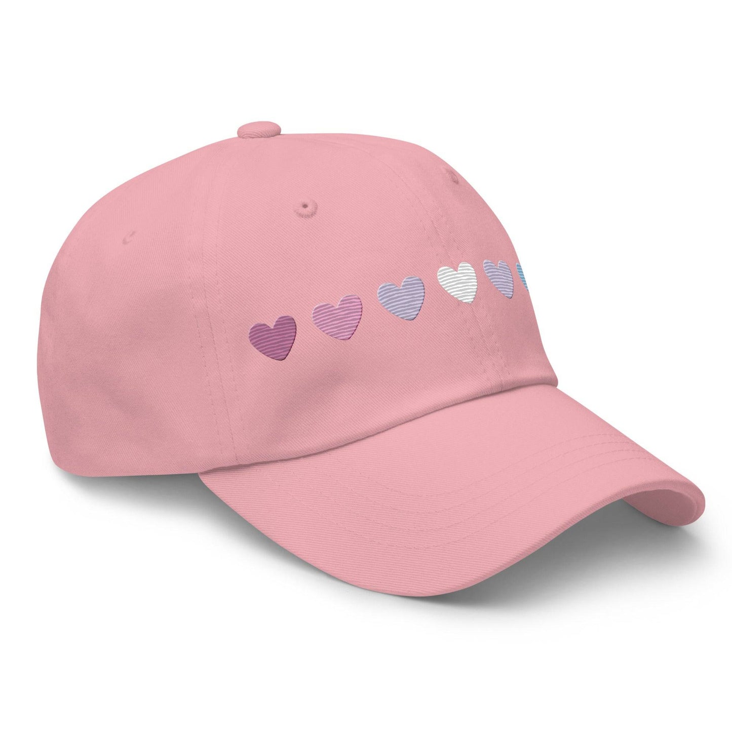 The Pridelity Bigender Hearts Cap, part of our Pride Collection, showcases a row of seven gradient heart symbols transitioning in color from pink to white to blue on a black base.