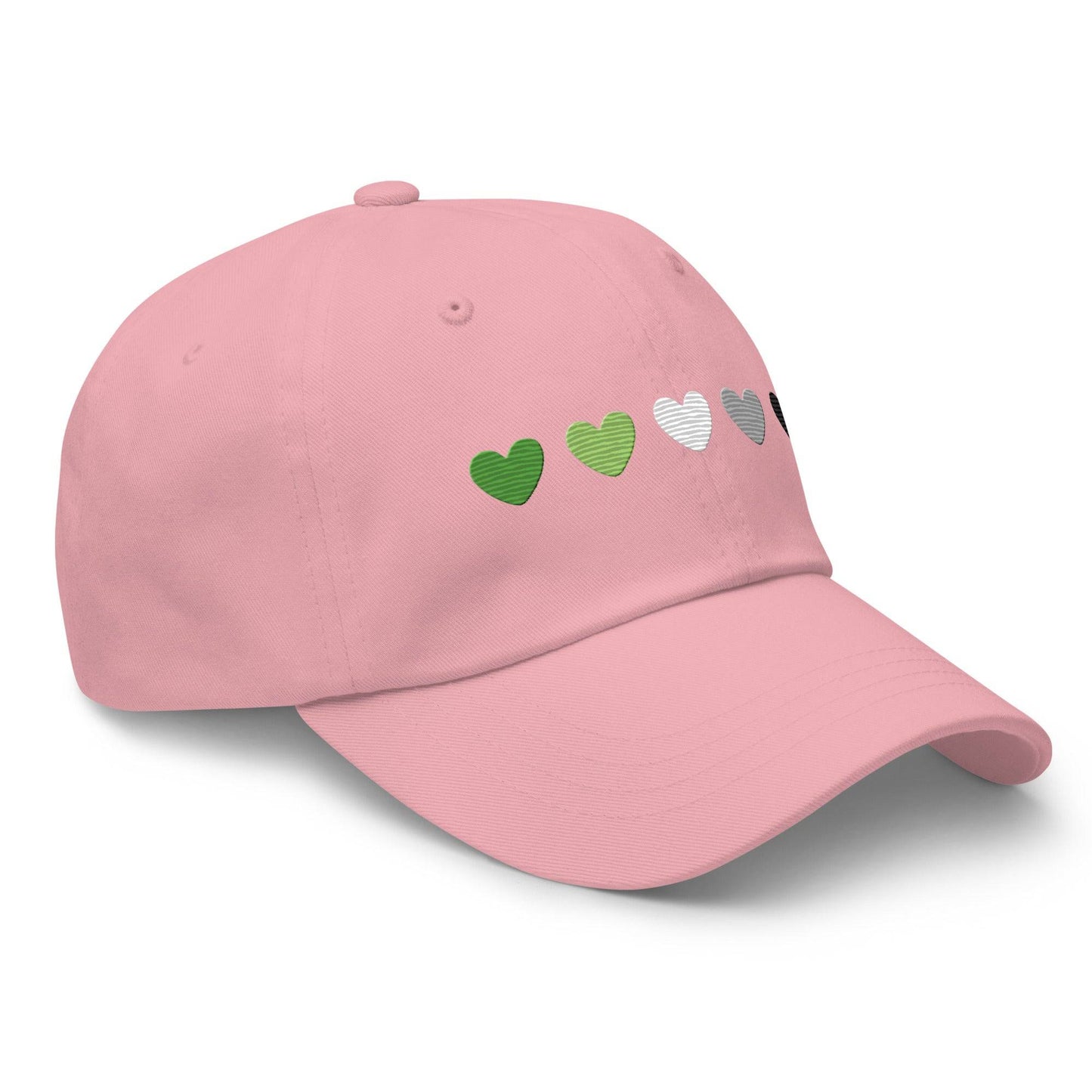 The Aromantic Hearts Cap by Pridelity, part of the Pride Collection, is a beige baseball cap featuring five hearts in a row colored dark green, light green, white, gray, and black to represent the aromantic pride flag.