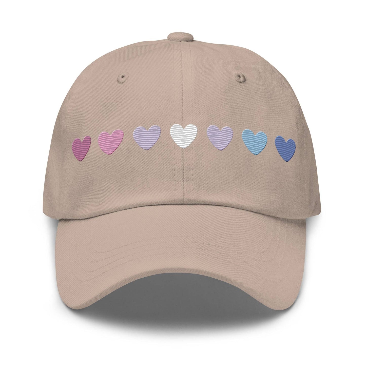 The Pridelity Bigender Hearts Cap, part of our Pride Collection, showcases a row of seven gradient heart symbols transitioning in color from pink to white to blue on a black base.