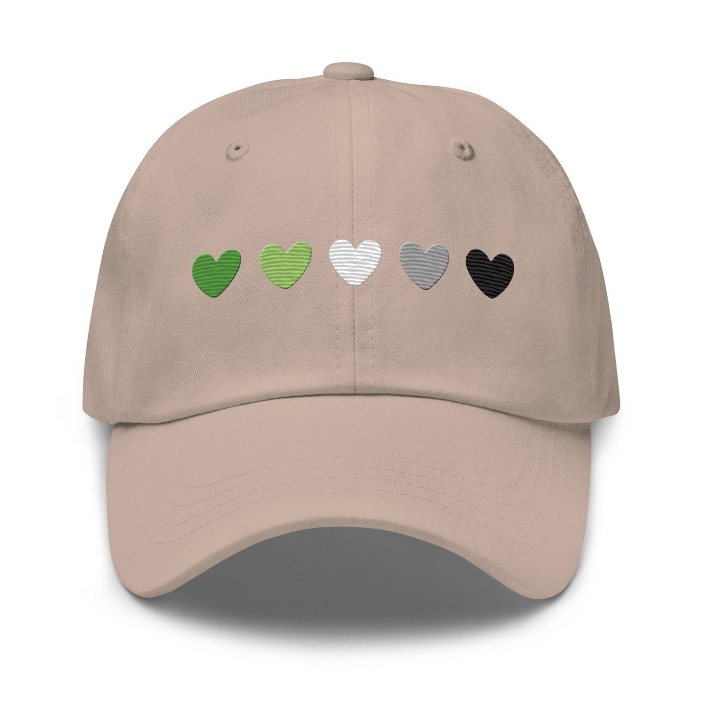 The Aromantic Hearts Cap by Pridelity, part of the Pride Collection, is a beige baseball cap featuring five hearts in a row colored dark green, light green, white, gray, and black to represent the aromantic pride flag.
