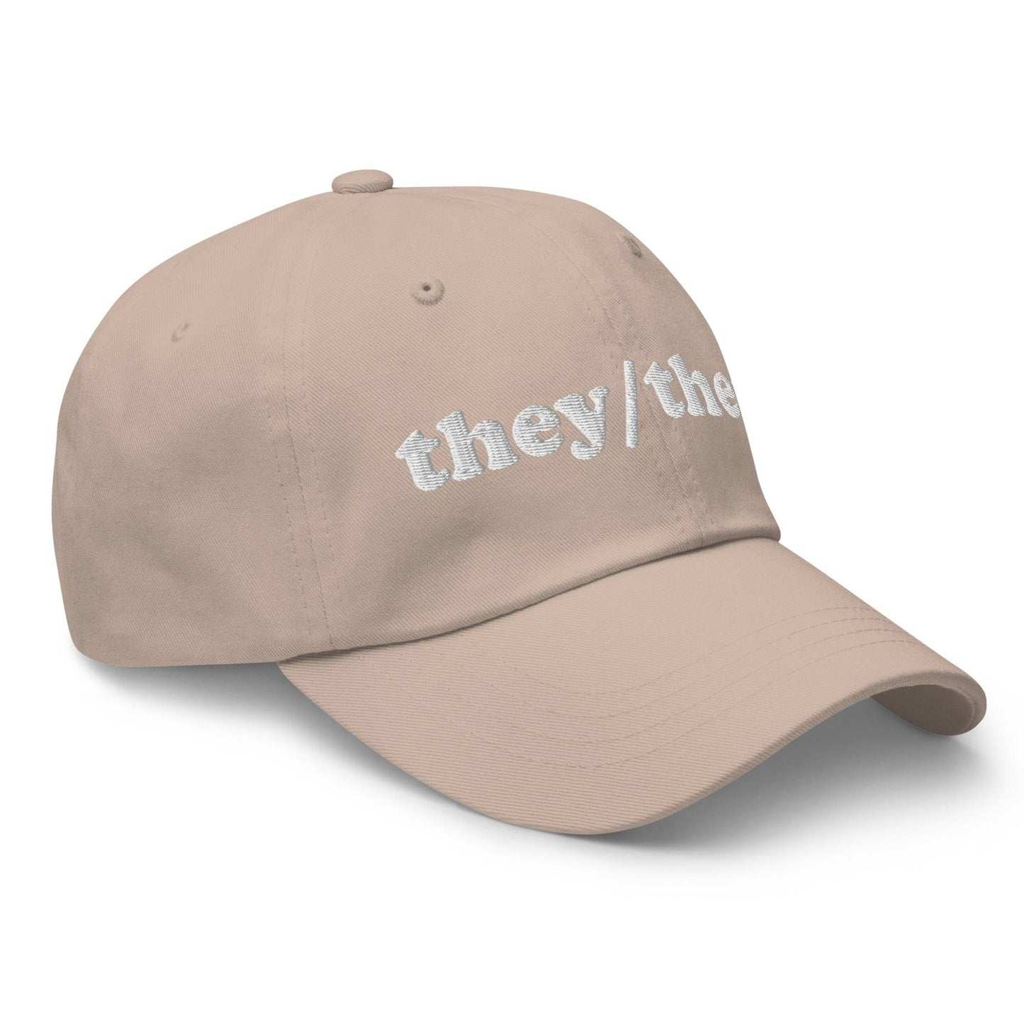 Introducing the They/Them Cap by Pridelity, a stylish black cap with "they/them" embroidered in white on the front, making it an ideal accessory for pairing with pride outfits.