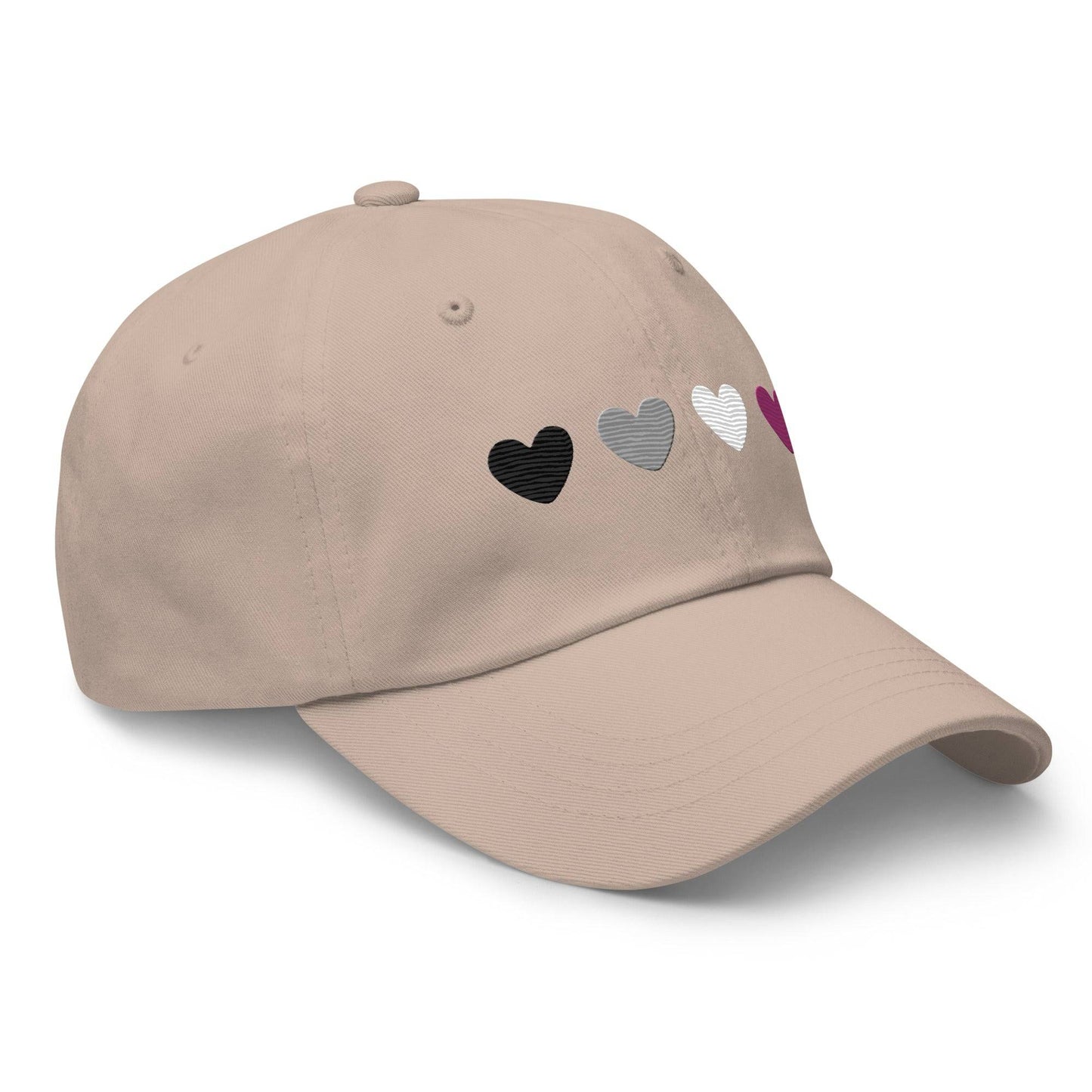 Introducing the Asexual Hearts Cap from Pridelity's Pride Collections, this pink baseball cap proudly displays four hearts in black, gray, white, and purple to represent the asexual flag.