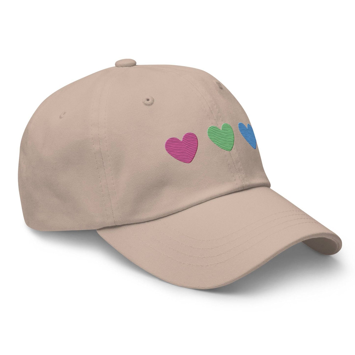 The Polysexual Hearts Cap by Pridelity is a black baseball cap ideal for pride outfits, featuring three embroidered hearts in pink, green, and blue arranged in a row on the front.