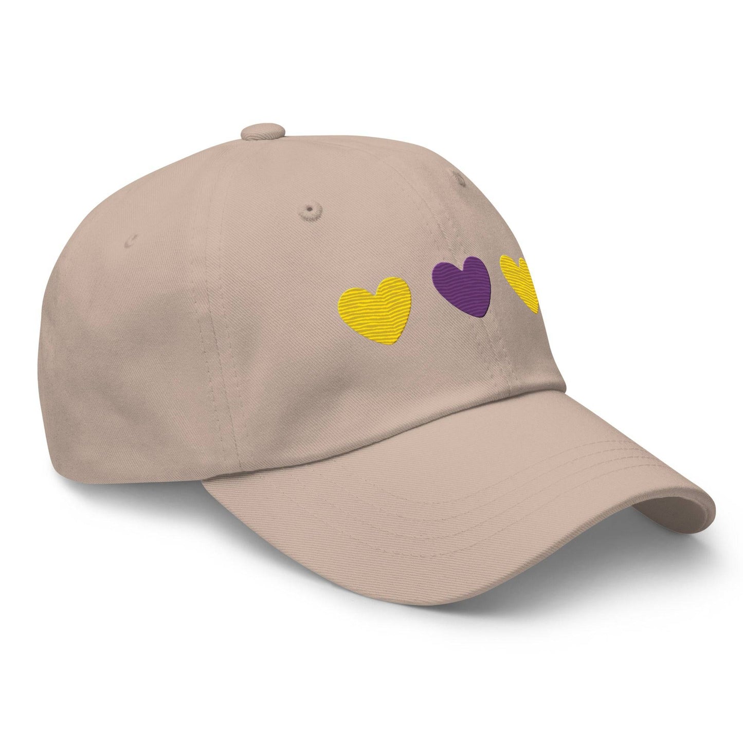 Introducing the Intersex Hearts Cap by Pridelity, a stylish black baseball cap ideal for pride outfits. It features three embroidered hearts, with two yellow ones on the sides and a purple heart prominently in the center.