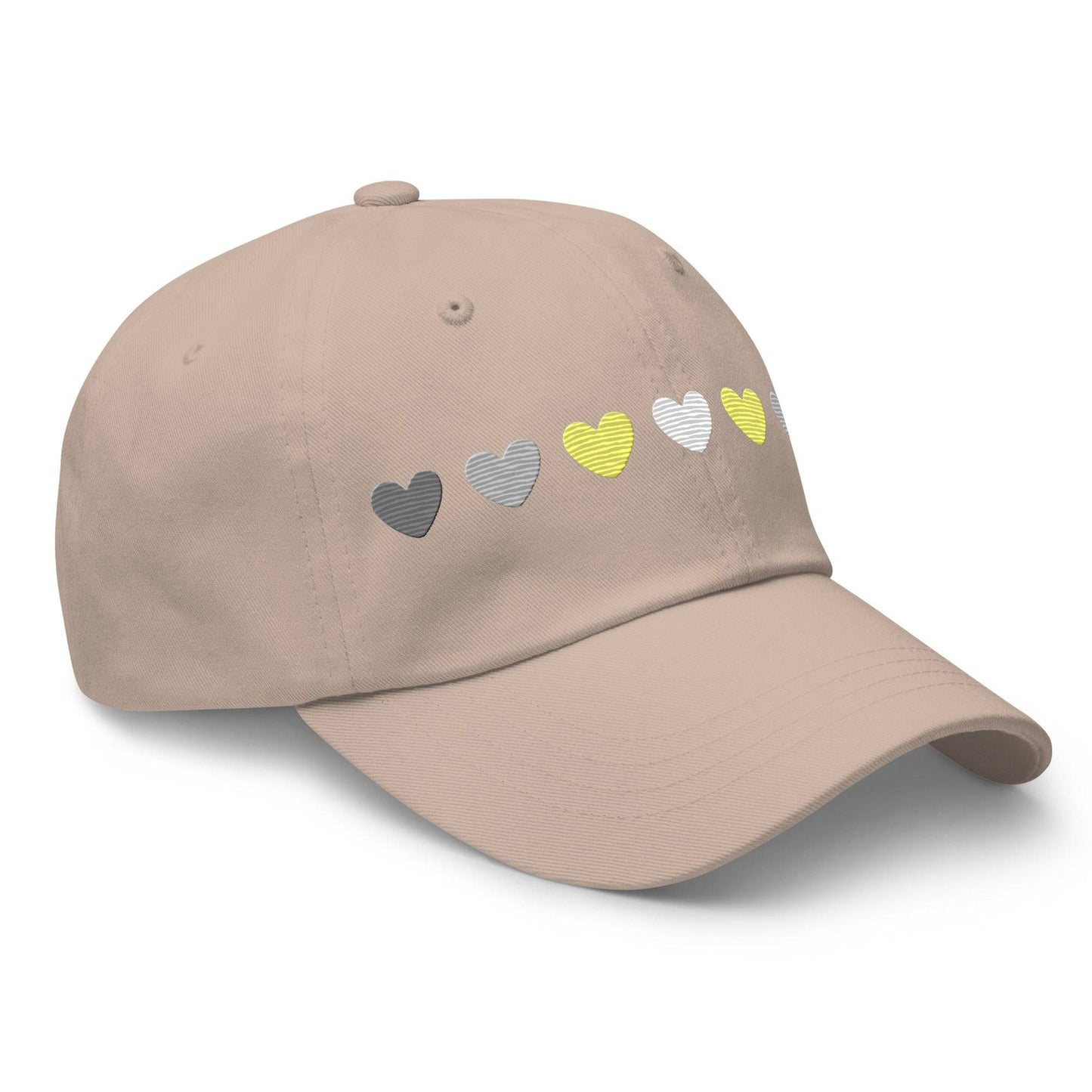 Introducing the Demigender Hearts Cap by Pridelity, a stylish black baseball cap ideal for pride outfits. It features a row of hearts embroidered on the front, transitioning seamlessly from gray on the left to vibrant yellow in the center, and back to gray on the right.