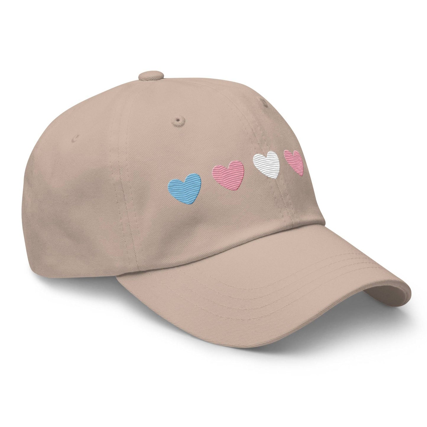 Introducing the "Trans Hearts Cap" from Pridelity, a black baseball cap adorned with embroidered pastel heart designs in pink, white, and blue on the front, making it an ideal accessory to enhance your pride outfits.