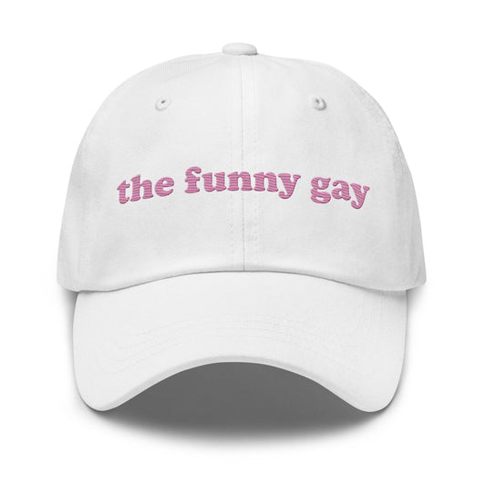 Introducing "The Funny Gay Cap" by Pridelity, a white cap featuring pink embroidered text that reads "the funny gay," ideal for adding a playful flair to your pride ensembles.