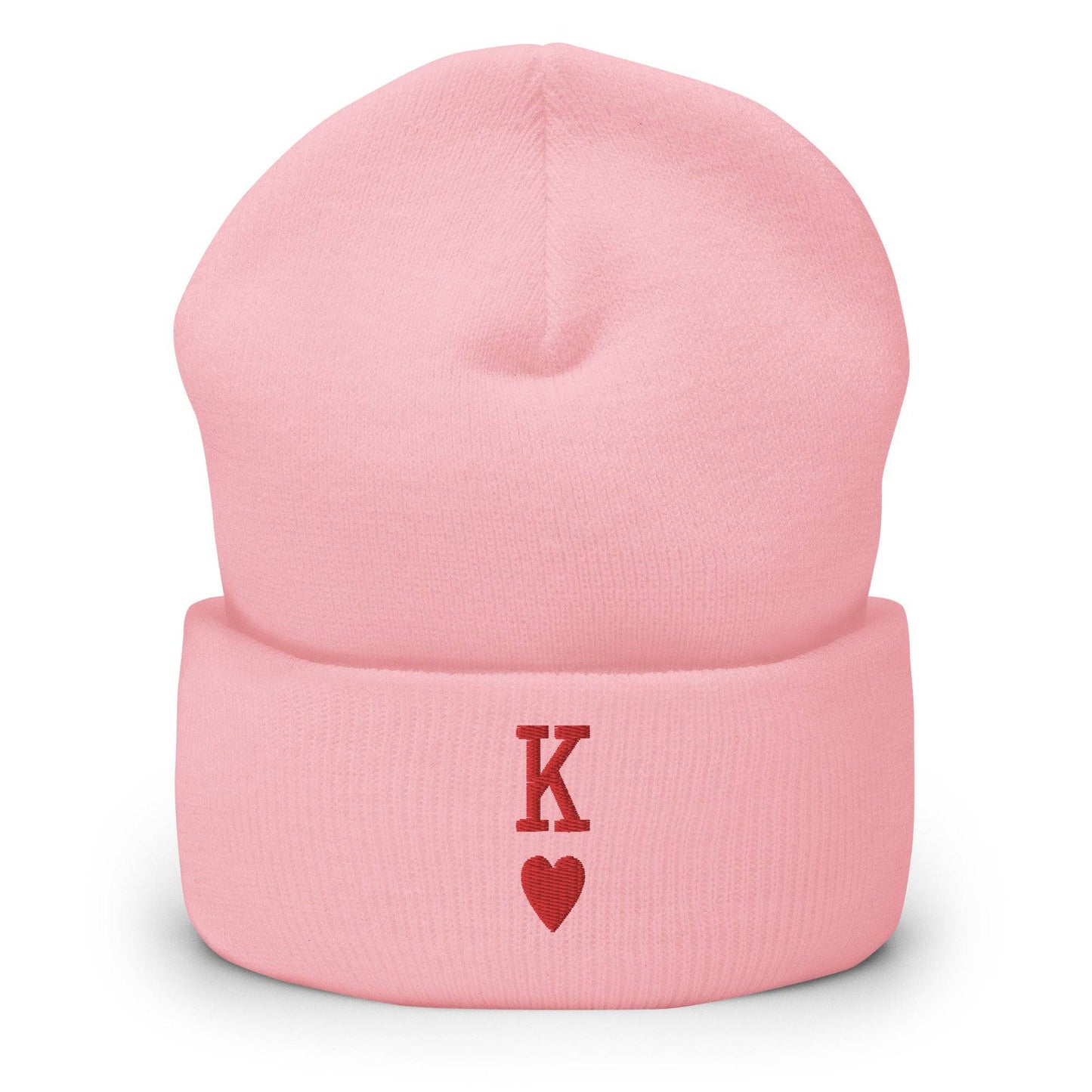 The King Beanie by Pridelity is a white beanie adorned with a red "K" and heart symbol on its folded edge, perfect for individuals expressing their identity through stylish gay clothing.