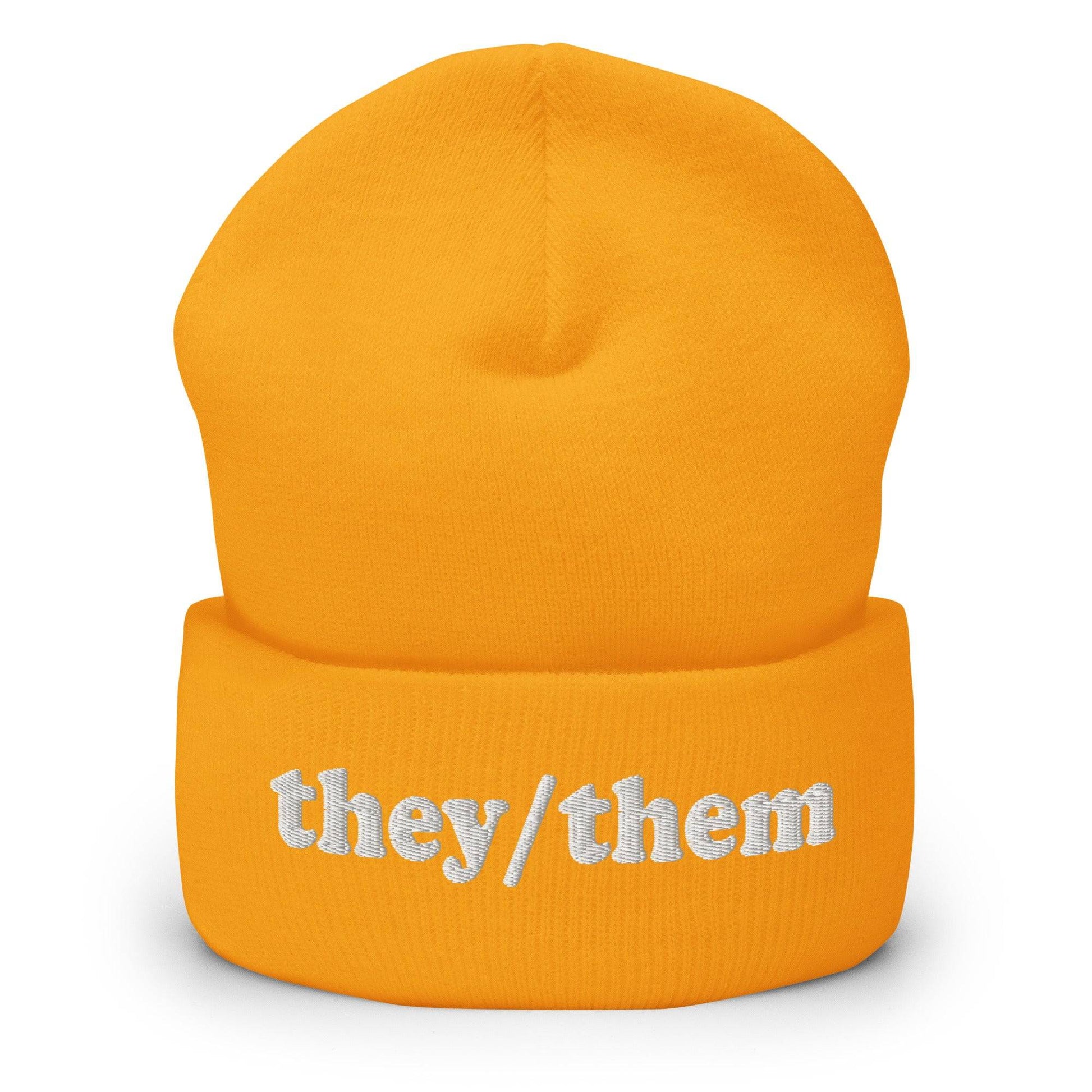 The Pridelity They/Them Beanie in heather grey features "they/them" embroidered in white letters on the cuff, making it a stylish essential for those seeking fashionable gay clothing.