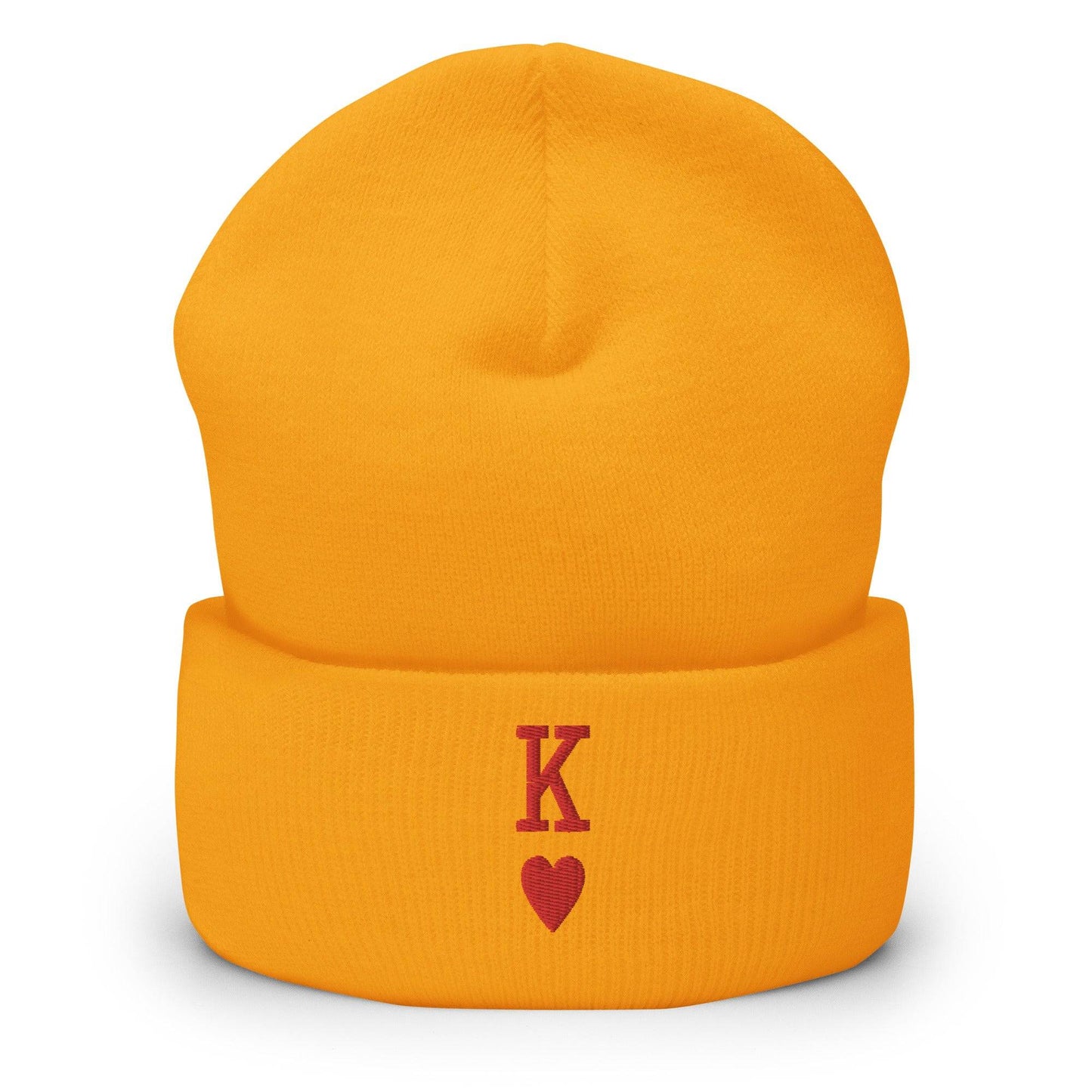 The King Beanie by Pridelity is a white beanie adorned with a red "K" and heart symbol on its folded edge, perfect for individuals expressing their identity through stylish gay clothing.