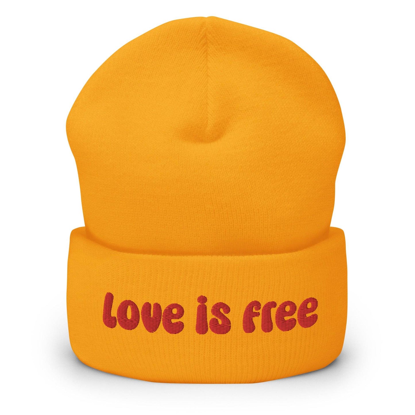The Love Is Free Beanie by Pridelity is a baby pink accessory that boldly features the phrase "Love is free" in red on the front cuff, making it a perfect and stylish addition to any gay clothing collection for those embracing their authentic selves.