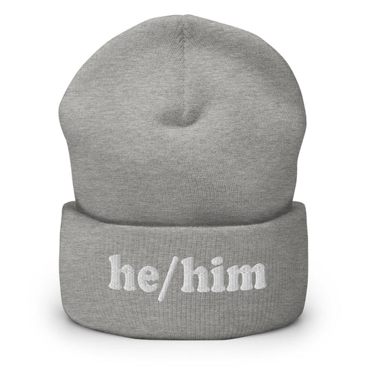 The He/Him Beanie by Pridelity, in a Heather Grey color, showcases "he/him" embroidered in white on the front, making it an ideal choice for those looking for understated yet meaningful LGBTQ+ apparel.