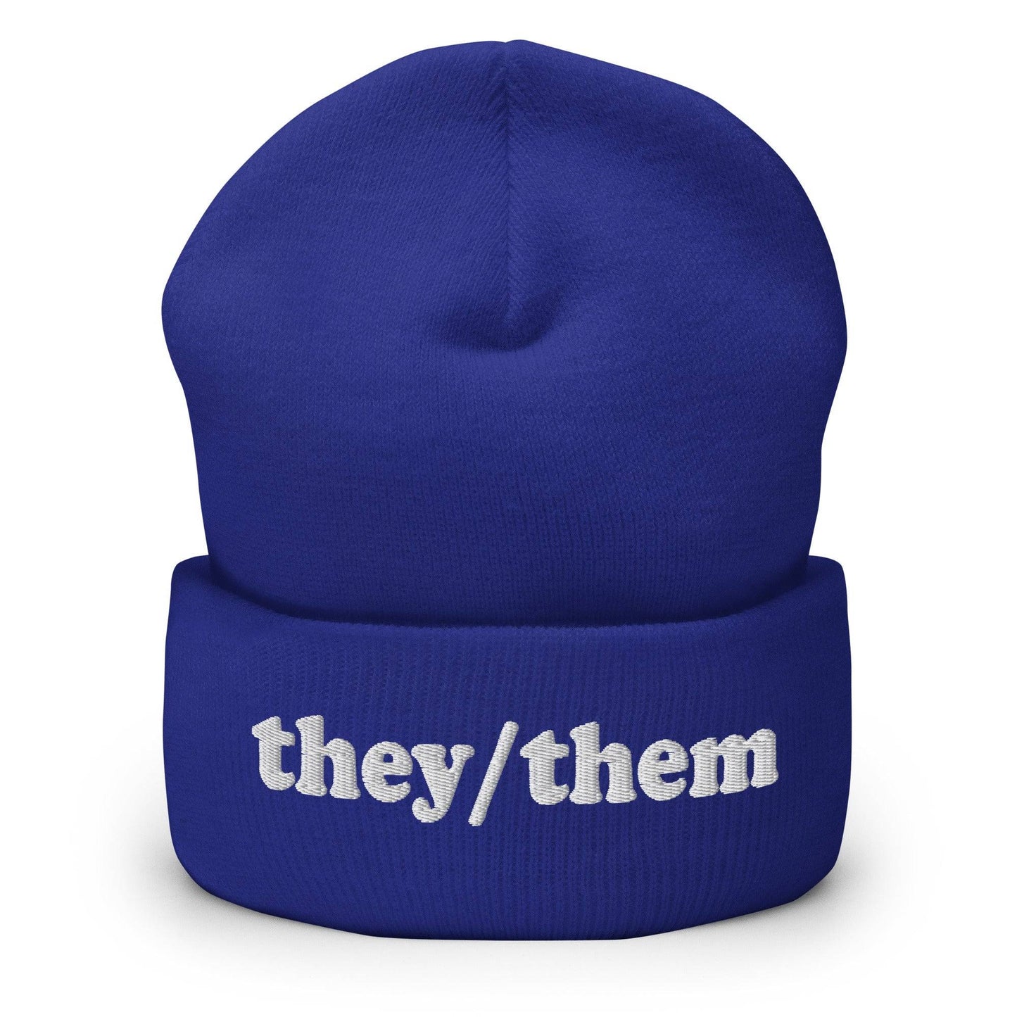 The Pridelity They/Them Beanie in heather grey features "they/them" embroidered in white letters on the cuff, making it a stylish essential for those seeking fashionable gay clothing.