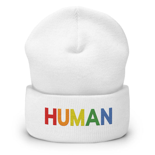 Discover the Human Beanie by Pridelity, a stylish white accessory featuring "HUMAN" embroidered in vibrant rainbow colors, capturing the spirit of gay clothing.