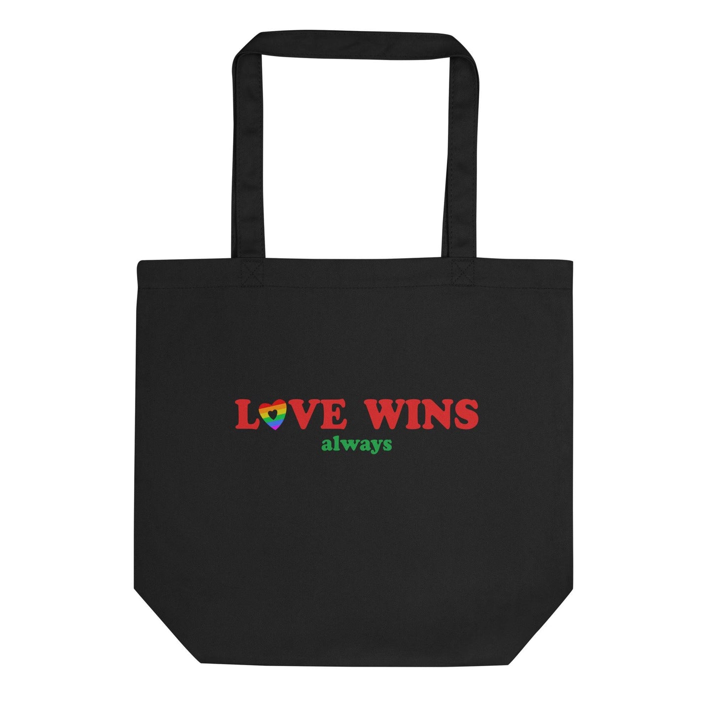 The Pridelity Love Wins, Always Tote Bag in black is available at the Rainbow Store. It showcases the words "LOVE WINS" in bold red letters, with a heart in vibrant rainbow colors replacing the letter "O," and the word "always" beautifully written in green beneath it. The tote bag includes two sturdy handles for convenient carrying.