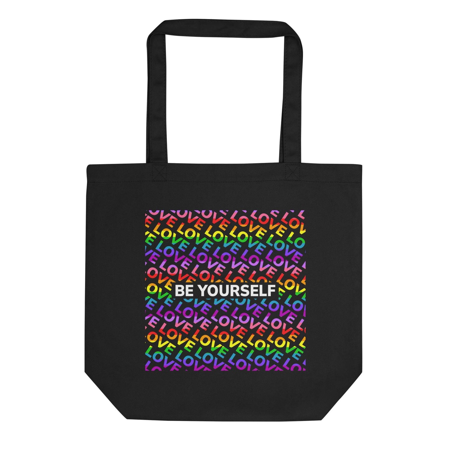 Introducing the "Be Yourself Tote Bag" from Pridelity: a stylish black tote adorned with a vibrant design on the front. Celebrate Pride with its backdrop of the word "LOVE" repeated in rainbow colors, complemented by "BE YOURSELF" boldly showcased in white. This unique piece is part of our exclusive Pride Merch collection.