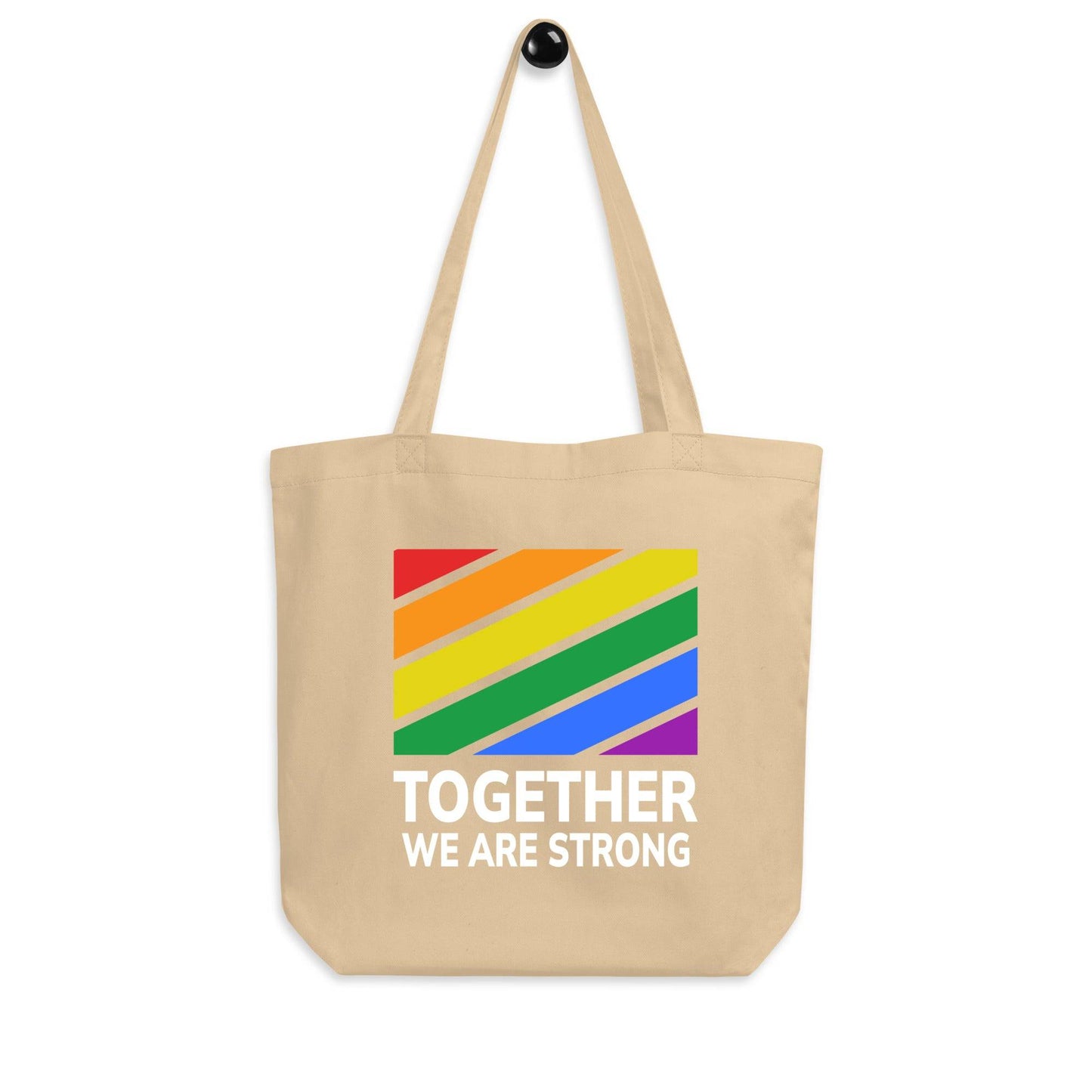 The Together Tote Bag from Pridelity features a black design with vibrant rainbow-striped accents and the message "TOGETHER WE ARE STRONG" in white.