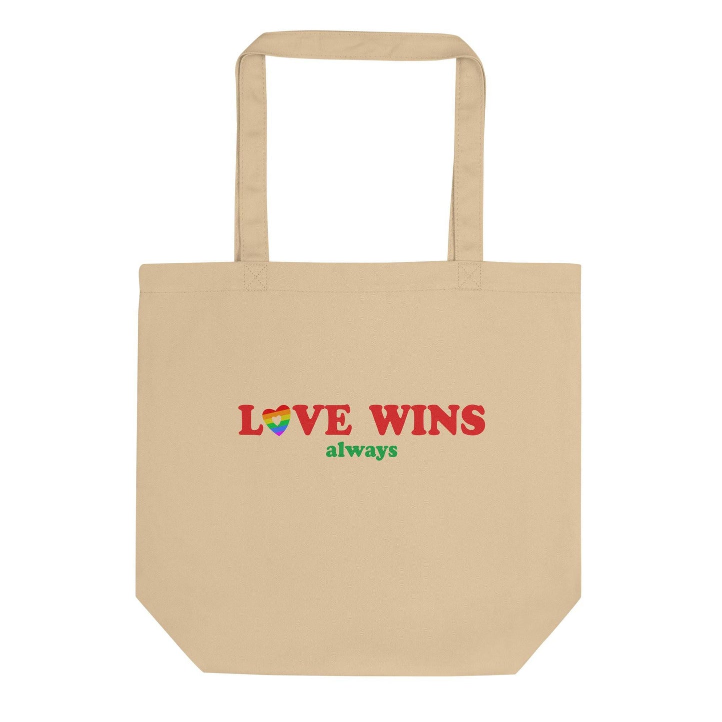 The Pridelity Love Wins, Always Tote Bag in black is available at the Rainbow Store. It showcases the words "LOVE WINS" in bold red letters, with a heart in vibrant rainbow colors replacing the letter "O," and the word "always" beautifully written in green beneath it. The tote bag includes two sturdy handles for convenient carrying.