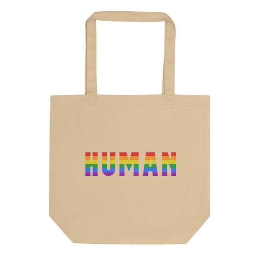 The Pridelity Human Tote Bag is a black tote with "HUMAN" showcased in a striking rainbow gradient on the front, akin to the colorful treasures at Rainbow Shops. It comes with two durable handles.