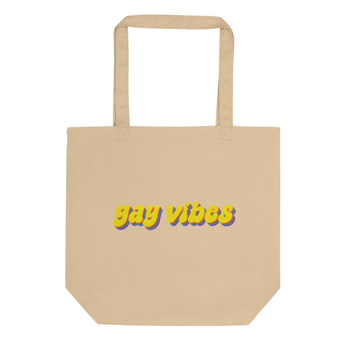 Introducing the Gay Vibes Tote Bag from Pridelity, a stylish black tote that proudly displays "gay vibes" in striking, colorful lettering. The dynamic text features a stunning gradient transition from yellow to purple, enhanced with a shadow effect. Ideal for any event, this versatile bag is designed with two durable top handles.