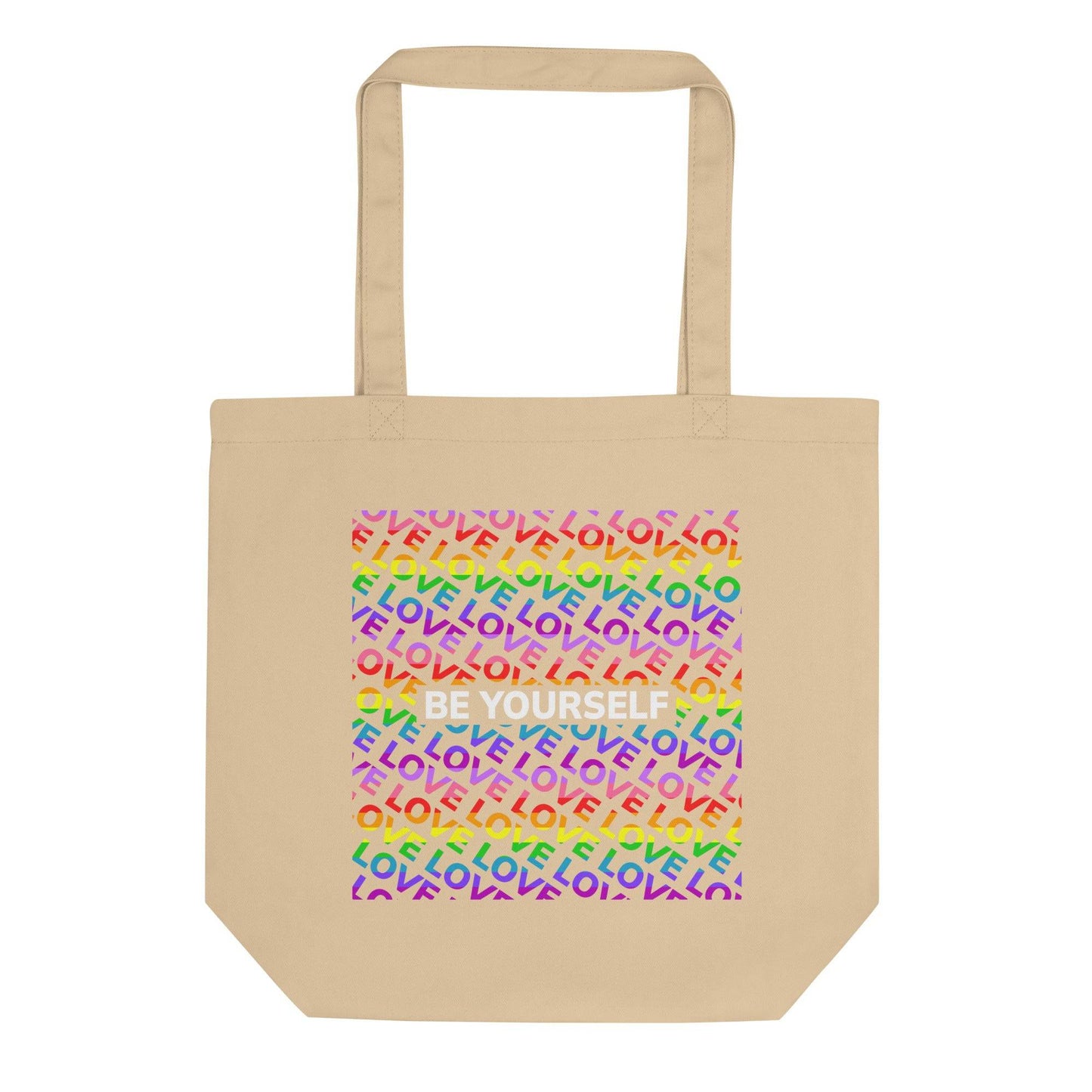 Introducing the "Be Yourself Tote Bag" from Pridelity: a stylish black tote adorned with a vibrant design on the front. Celebrate Pride with its backdrop of the word "LOVE" repeated in rainbow colors, complemented by "BE YOURSELF" boldly showcased in white. This unique piece is part of our exclusive Pride Merch collection.