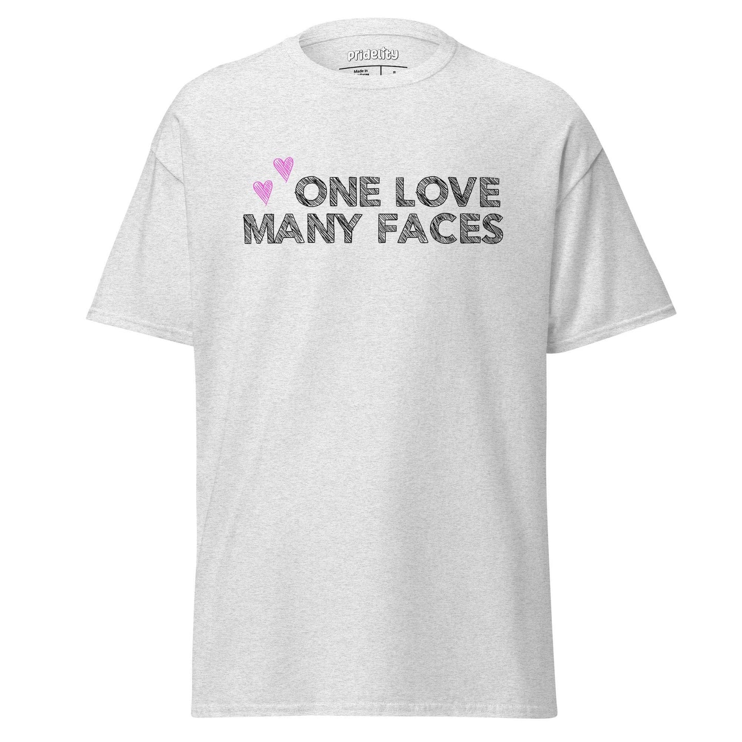 The One Love T-Shirt by Pridelity is a natural-colored pride shirt prominently displaying the message "One Love Many Faces" in bold black letters, complemented by two pink hearts above. It stands out elegantly against a simple white background, celebrating unity and diversity in style.