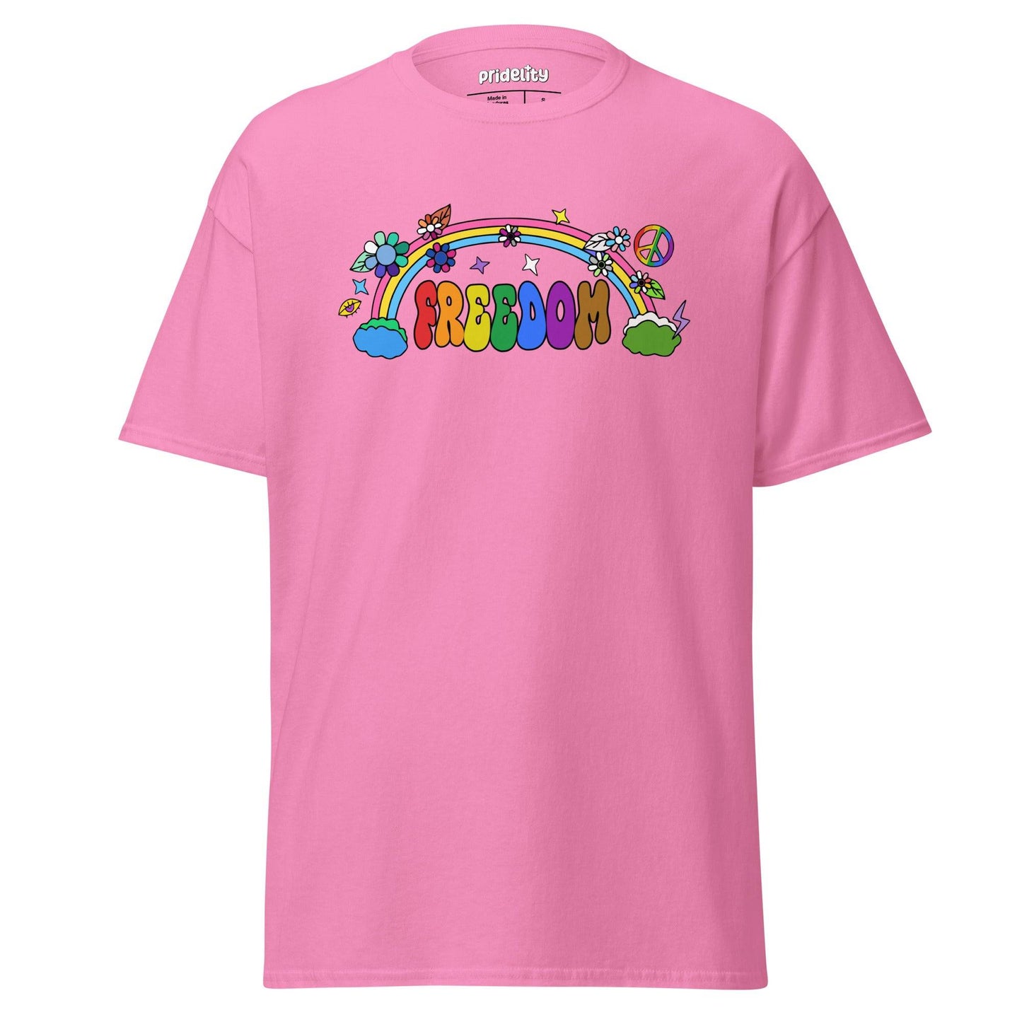 The Freedom T-Shirt by Pridelity features a colorful, cartoon-style design with "FREEDOM" in vibrant letters. A rainbow arches above clouds, flowers, and stars on the beige fabric, creating a whimsical and cheerful piece of pride merchandise.