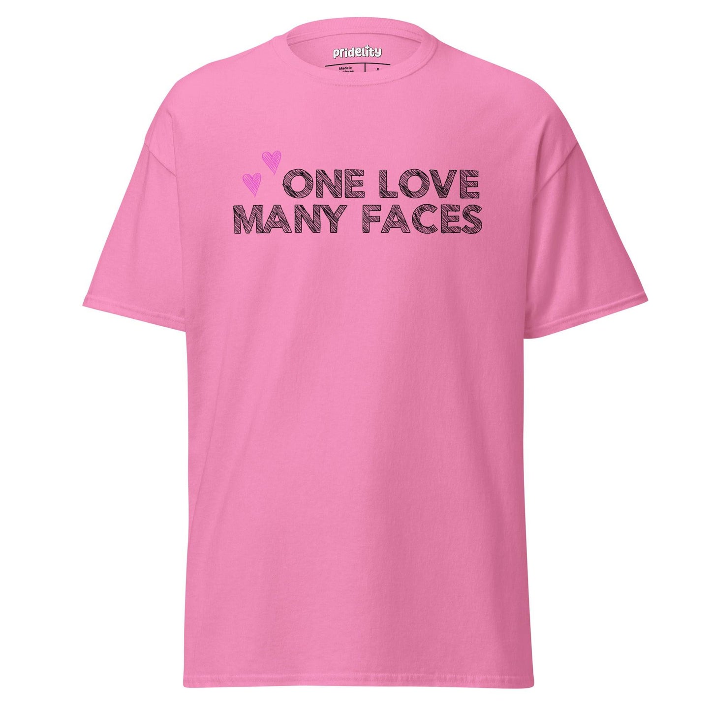 The One Love T-Shirt by Pridelity is a natural-colored pride shirt prominently displaying the message "One Love Many Faces" in bold black letters, complemented by two pink hearts above. It stands out elegantly against a simple white background, celebrating unity and diversity in style.