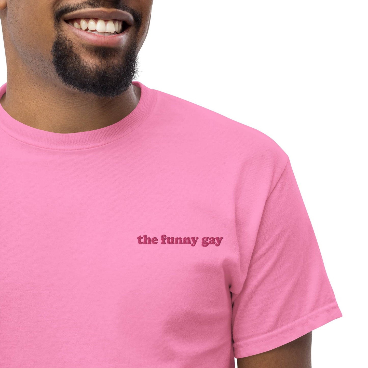An azalea Pridelity T-shirt named "The Funny Gay" with the text printed in small, simple font on the front.